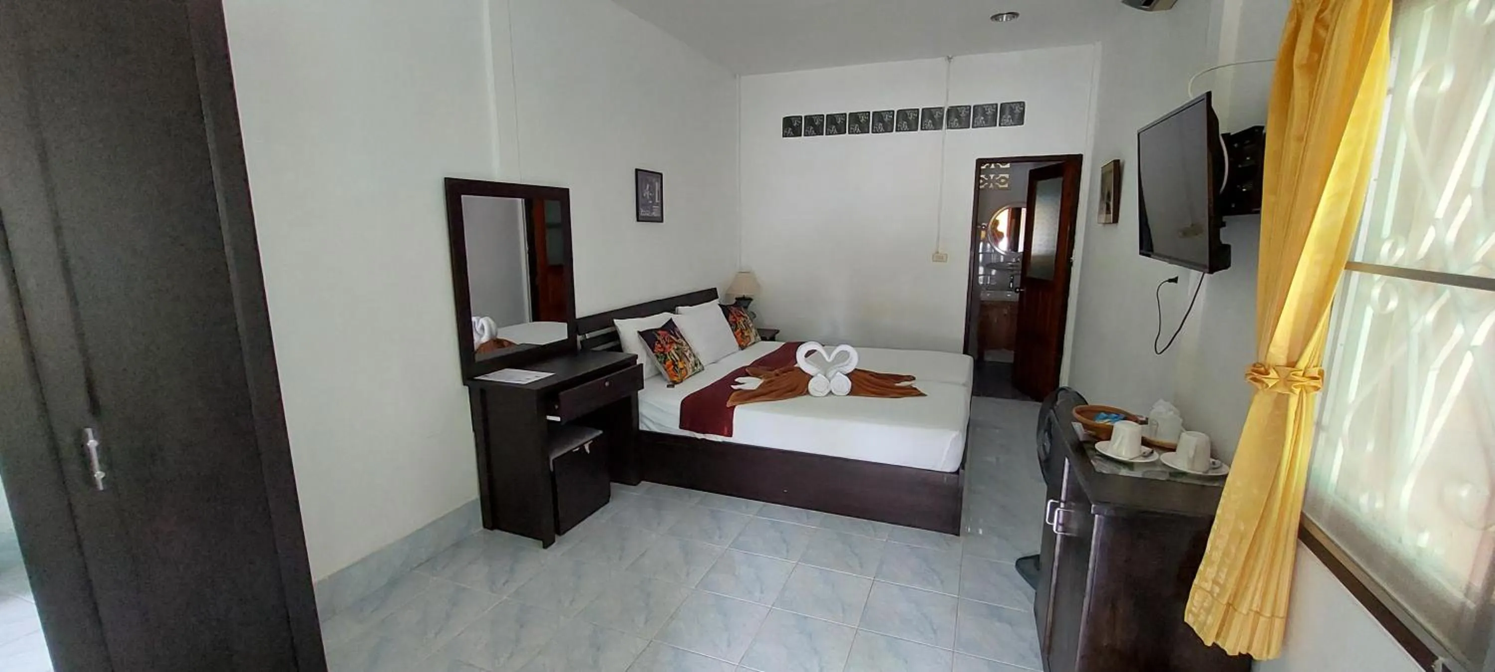 Bed in Jungle Village Bungalow