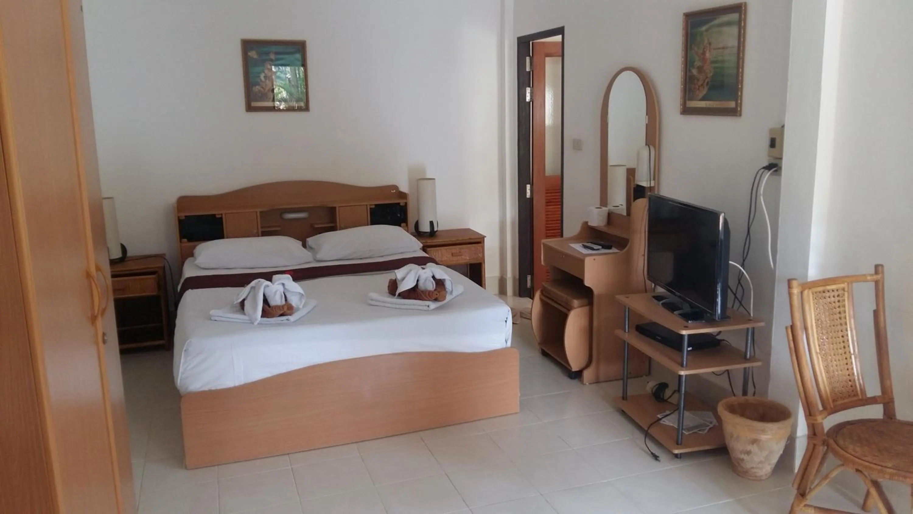 Bed in Jungle Village Bungalow