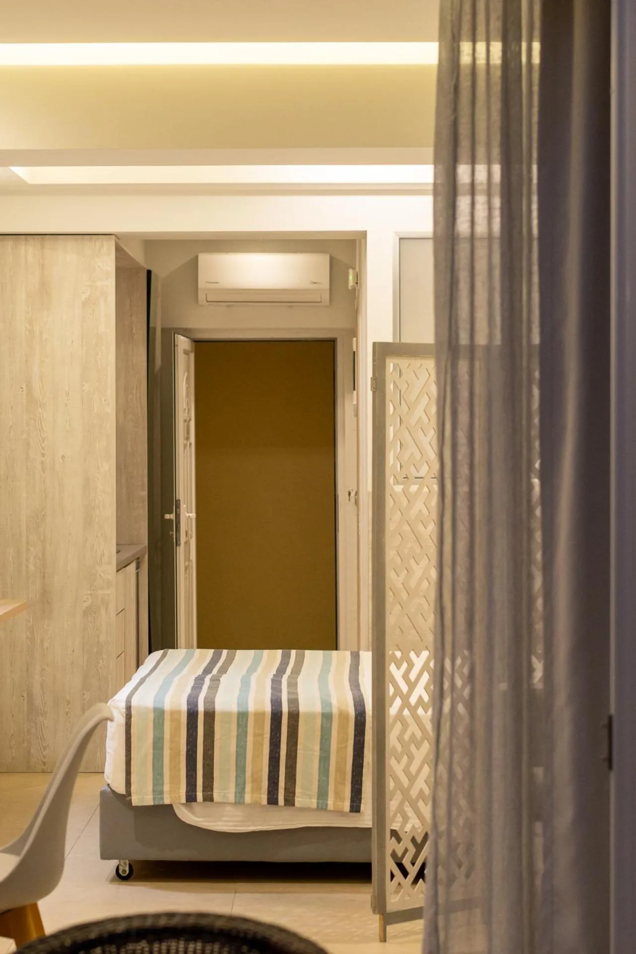 Bed in Elpis Studio Apartments