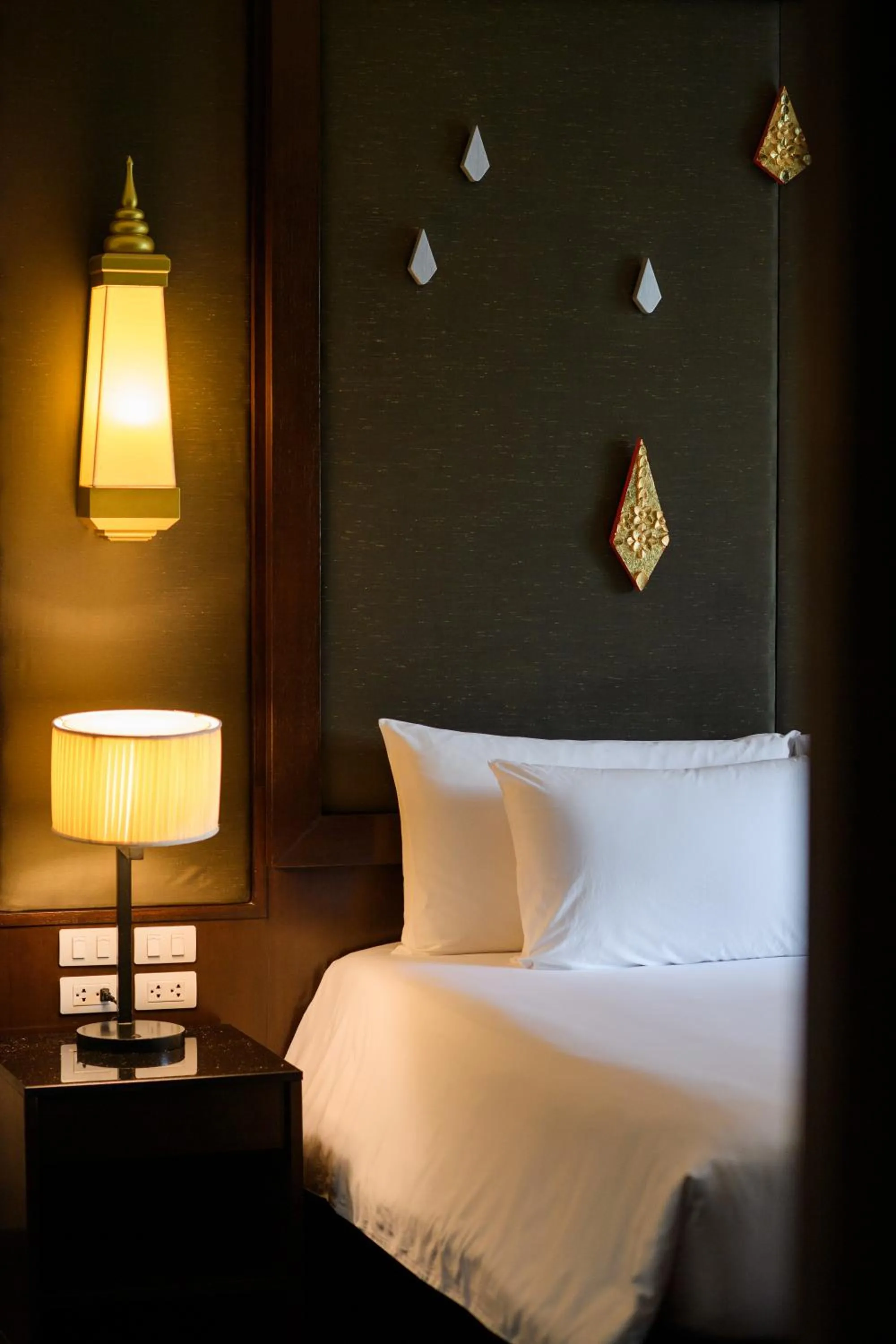 Bed in Centara Anda Dhevi Resort & Spa Krabi