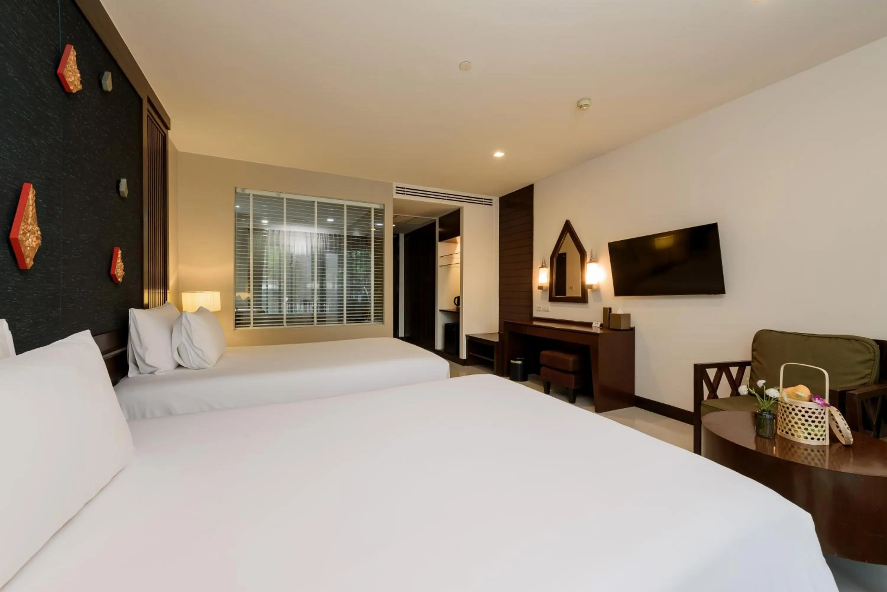 Bed in Centara Anda Dhevi Resort & Spa Krabi