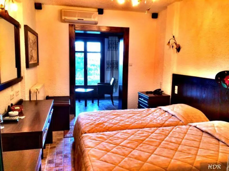 Bed in Hotel Taxiarches