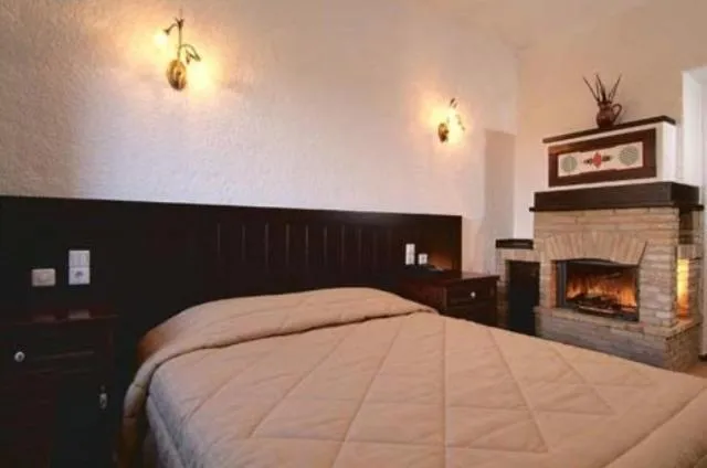 Bed in Hotel Taxiarches