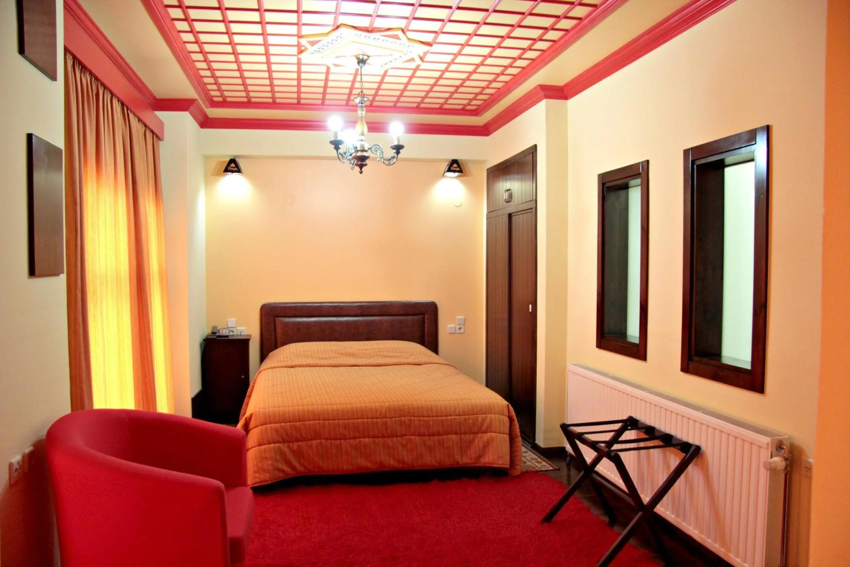 Bed in Hotel Taxiarches