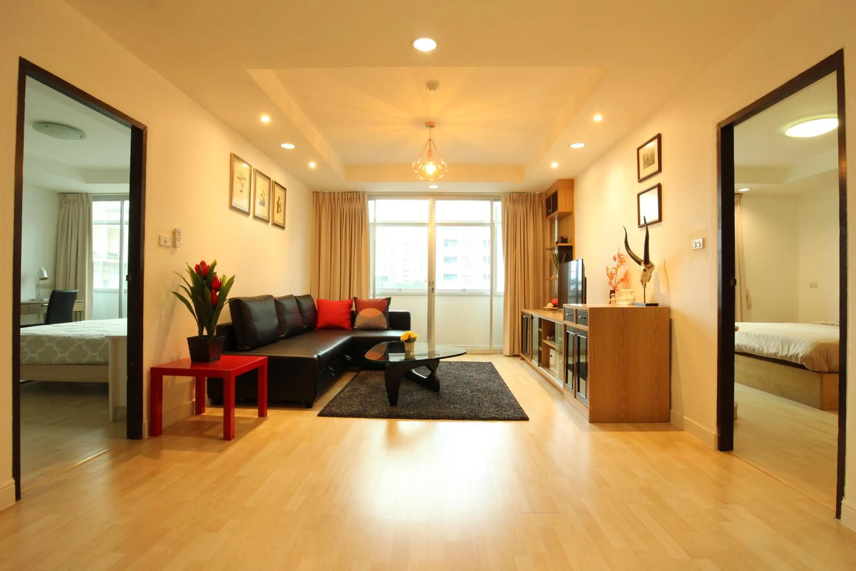 Living room, Bed in Serena Sathorn Suites