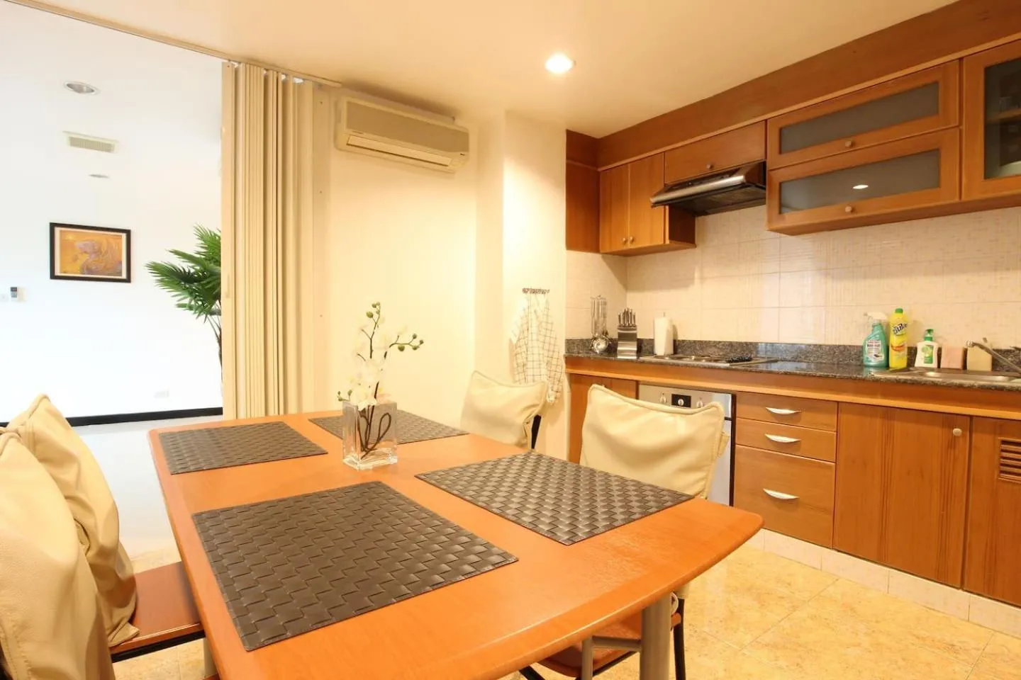Kitchen or kitchenette in Serena Sathorn Suites