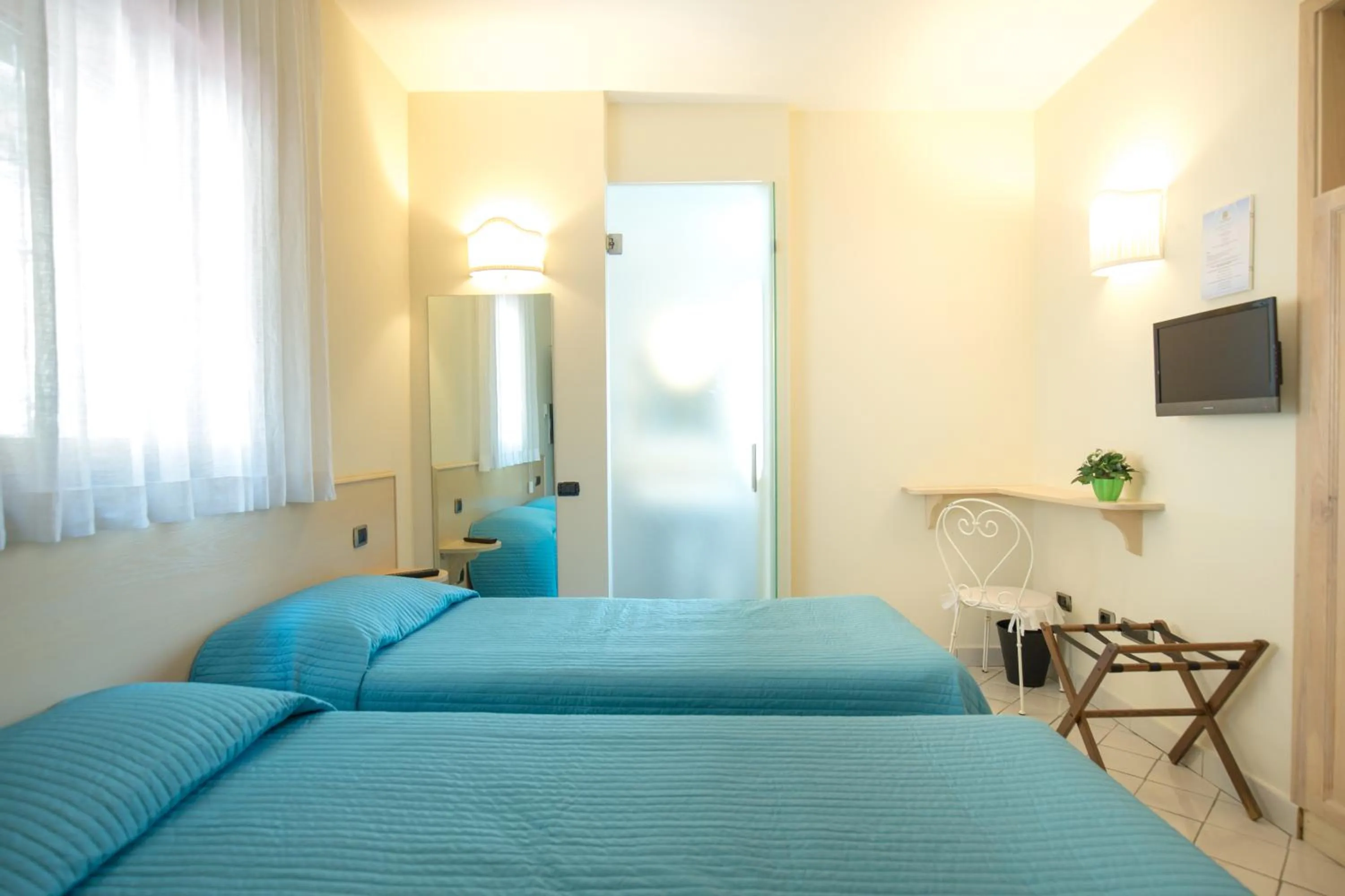 Bed in Villa Poseidon -Boutique Hotel-
