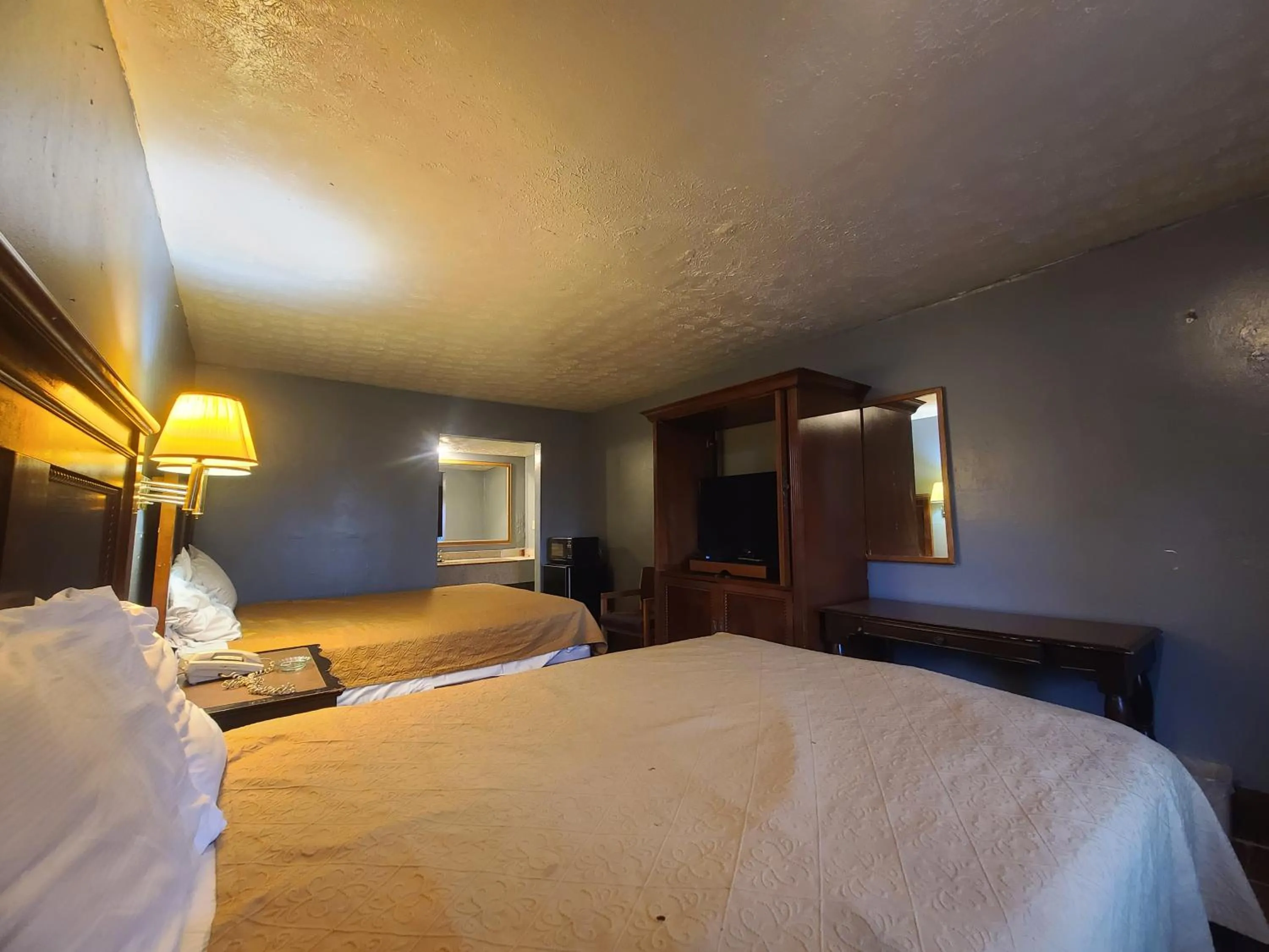 Bed in Garden Inn and Extended Stay