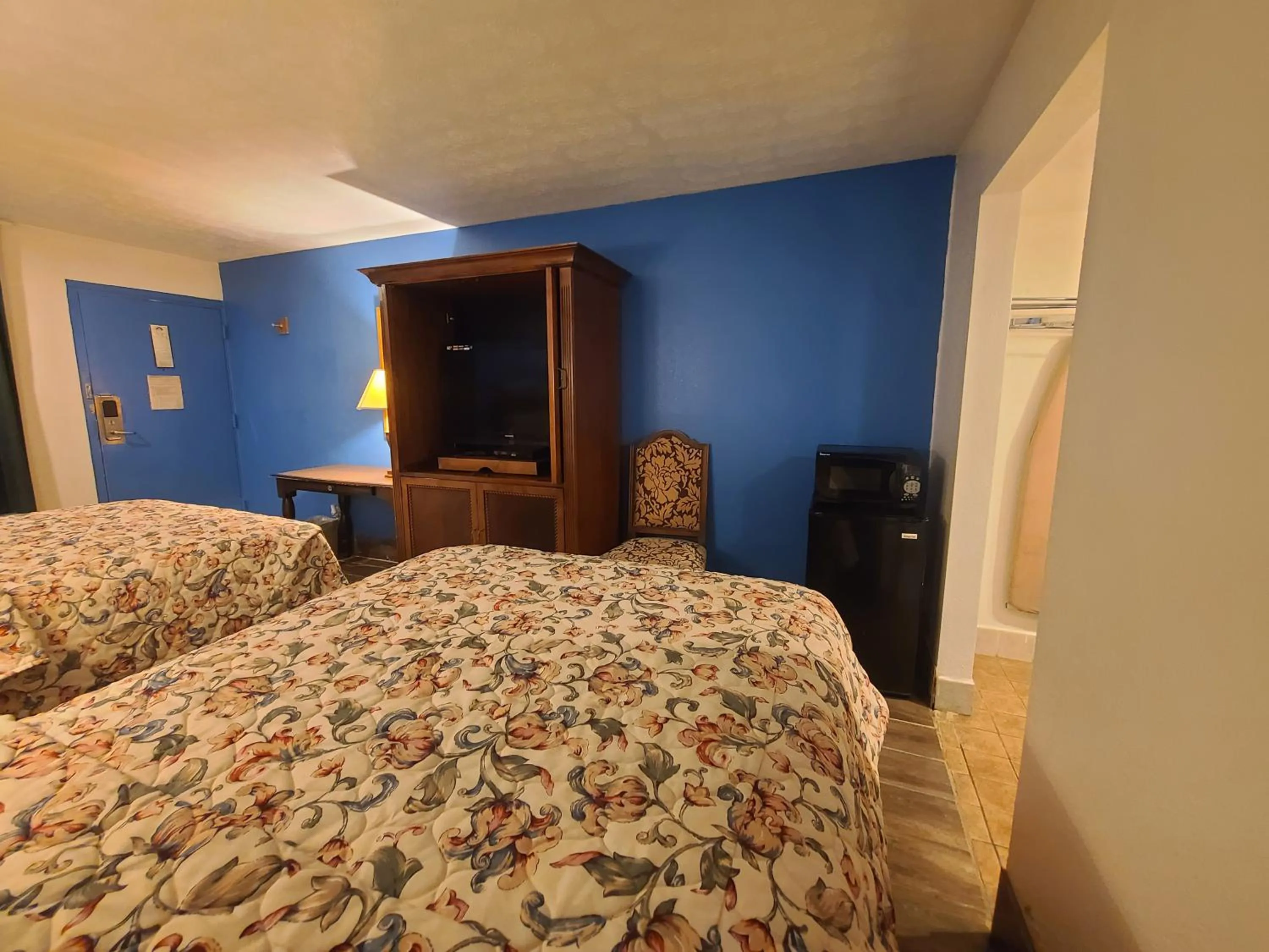 Bed in Garden Inn and Extended Stay
