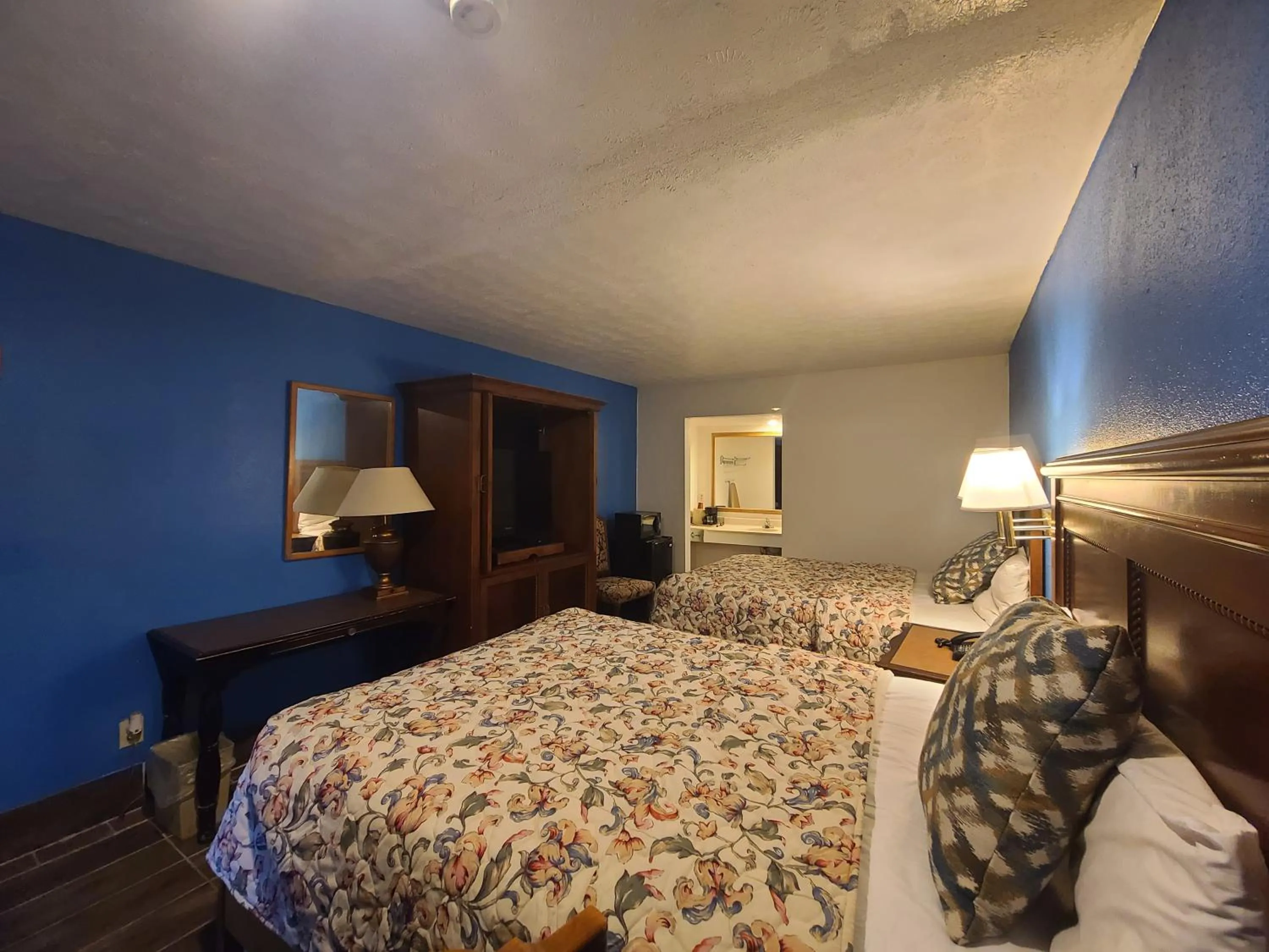 Bed in Garden Inn and Extended Stay