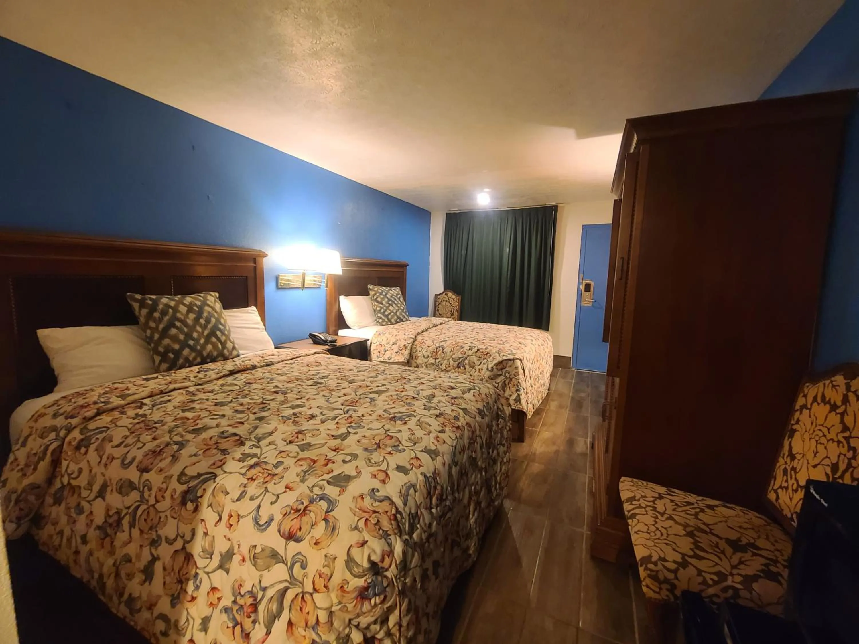 Bed in Garden Inn and Extended Stay