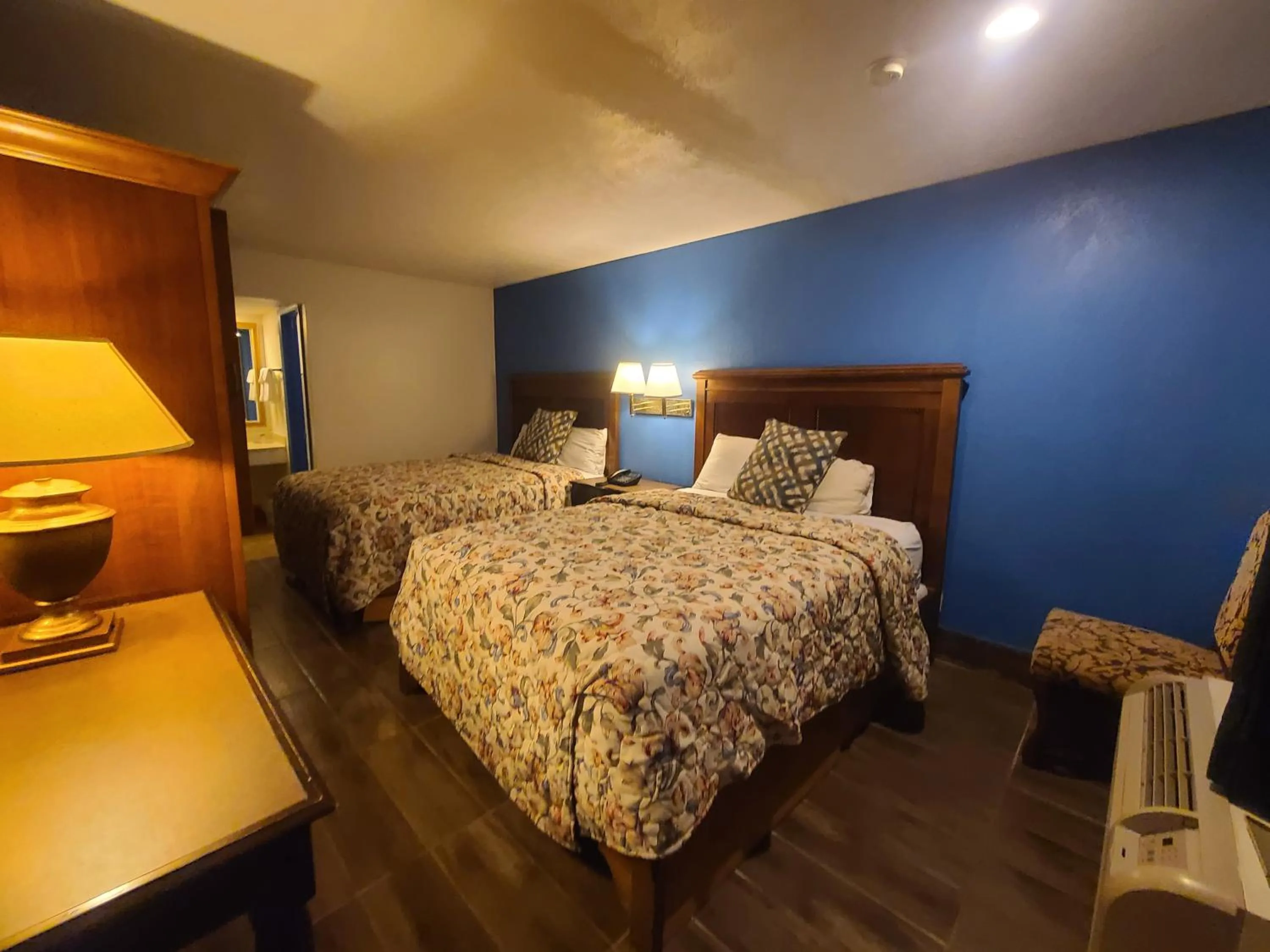 Bed in Garden Inn and Extended Stay