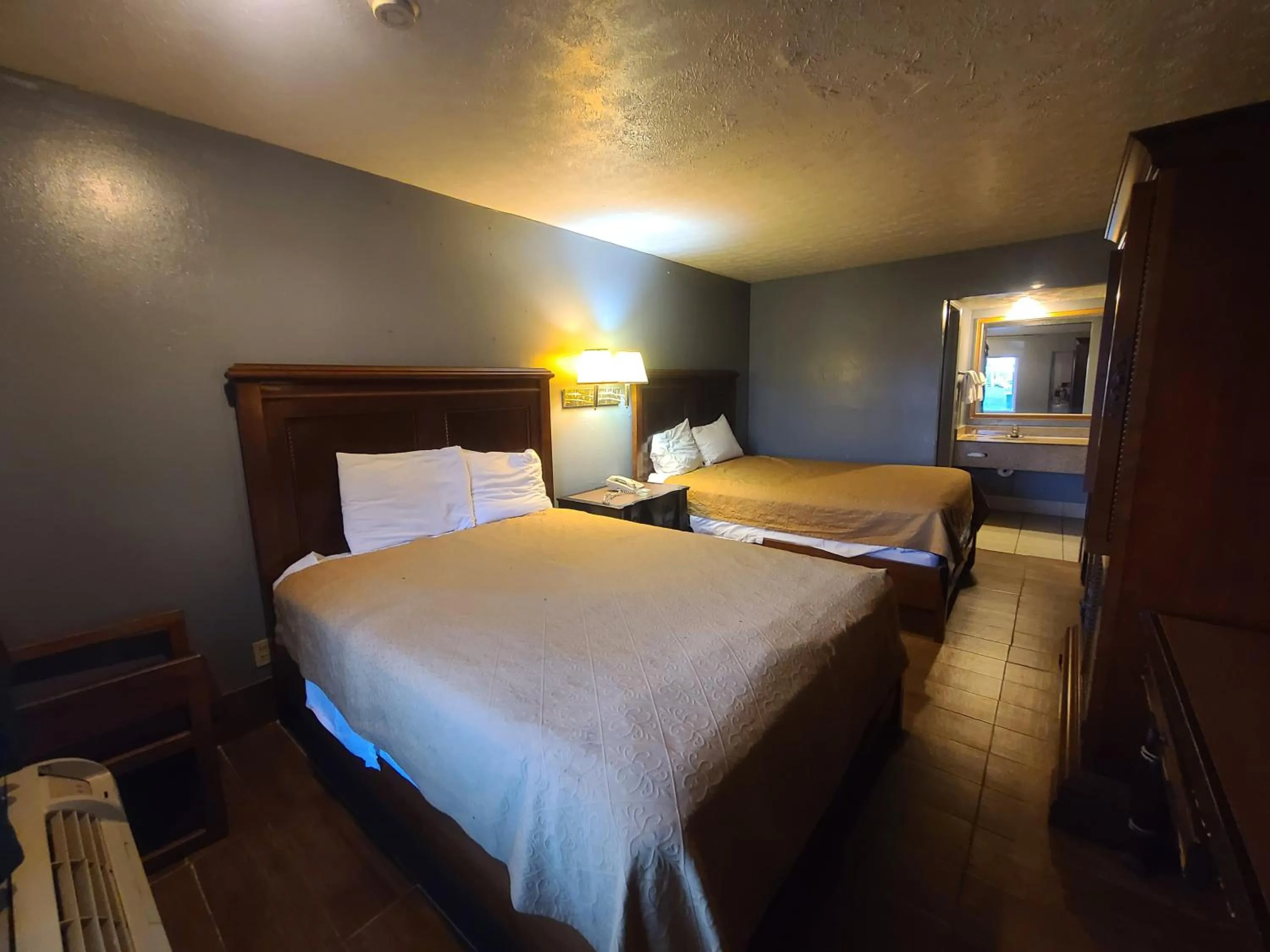 Bed in Garden Inn and Extended Stay