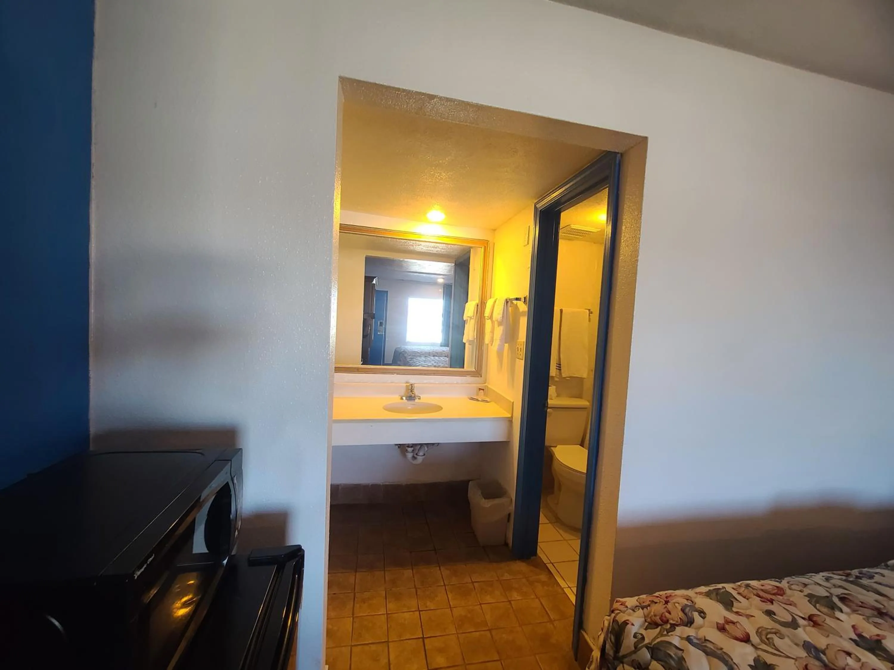 Bed in Garden Inn and Extended Stay