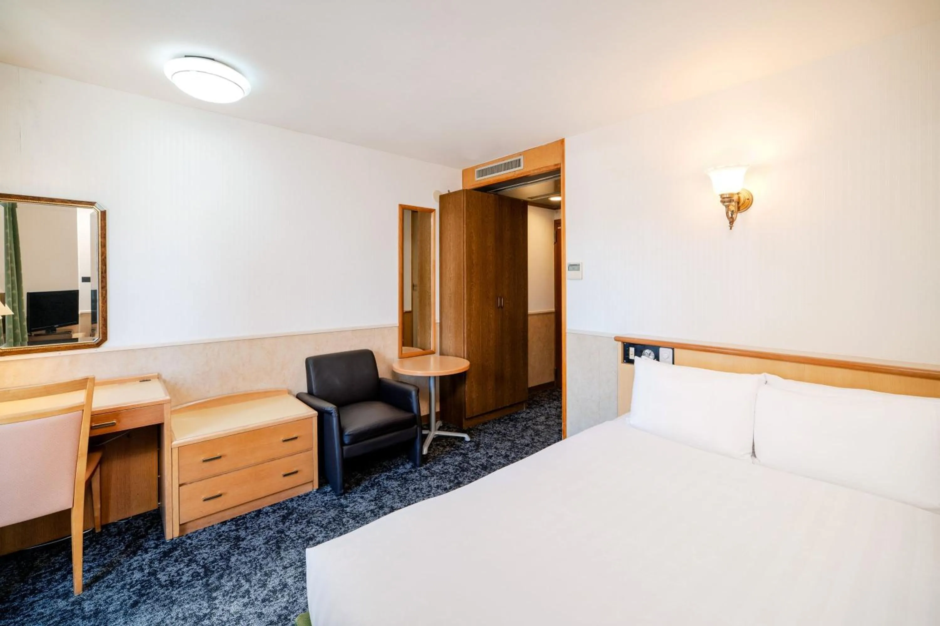 Bed in Central Hotel Sasebo