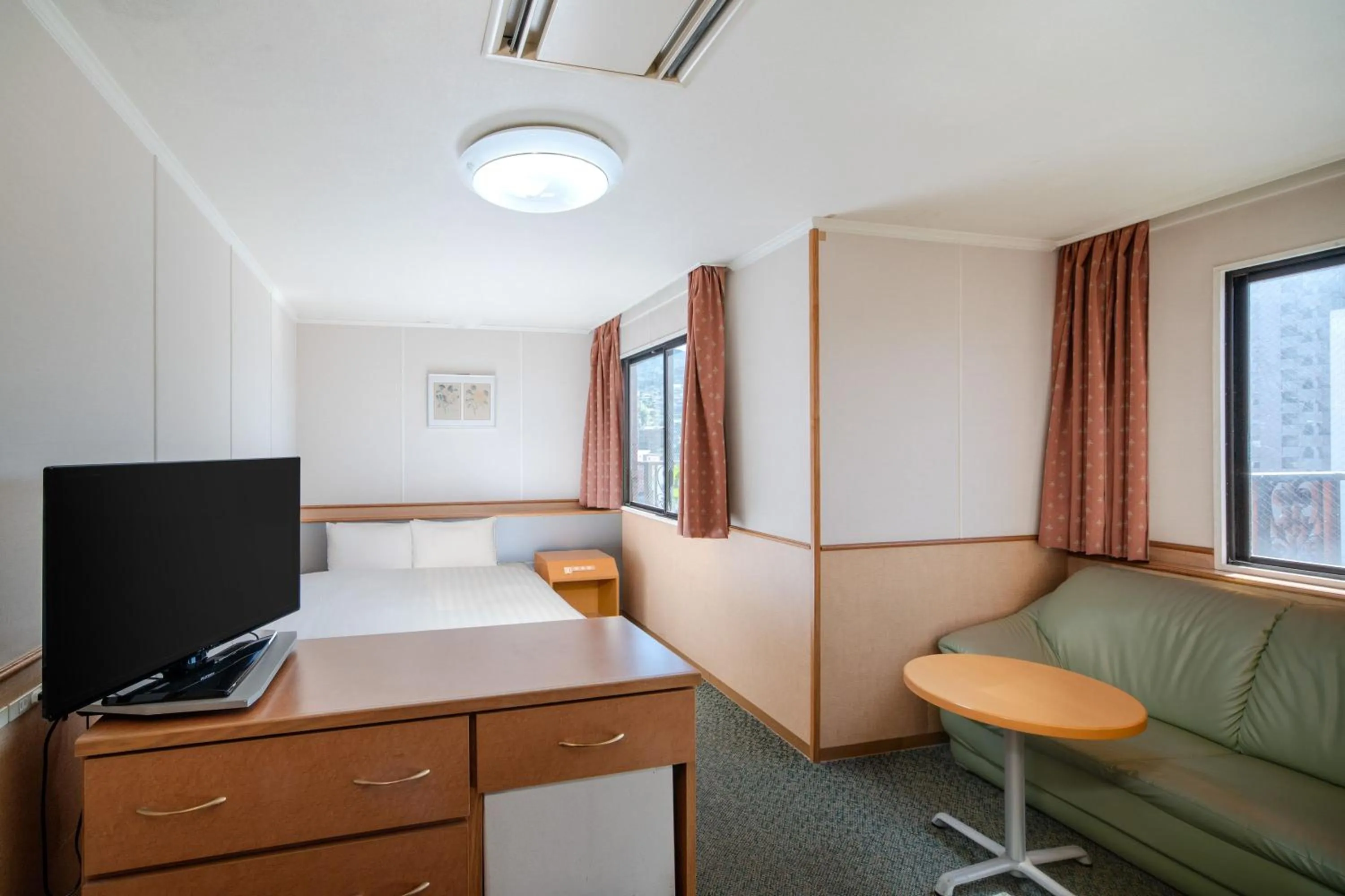 Bed in Central Hotel Sasebo