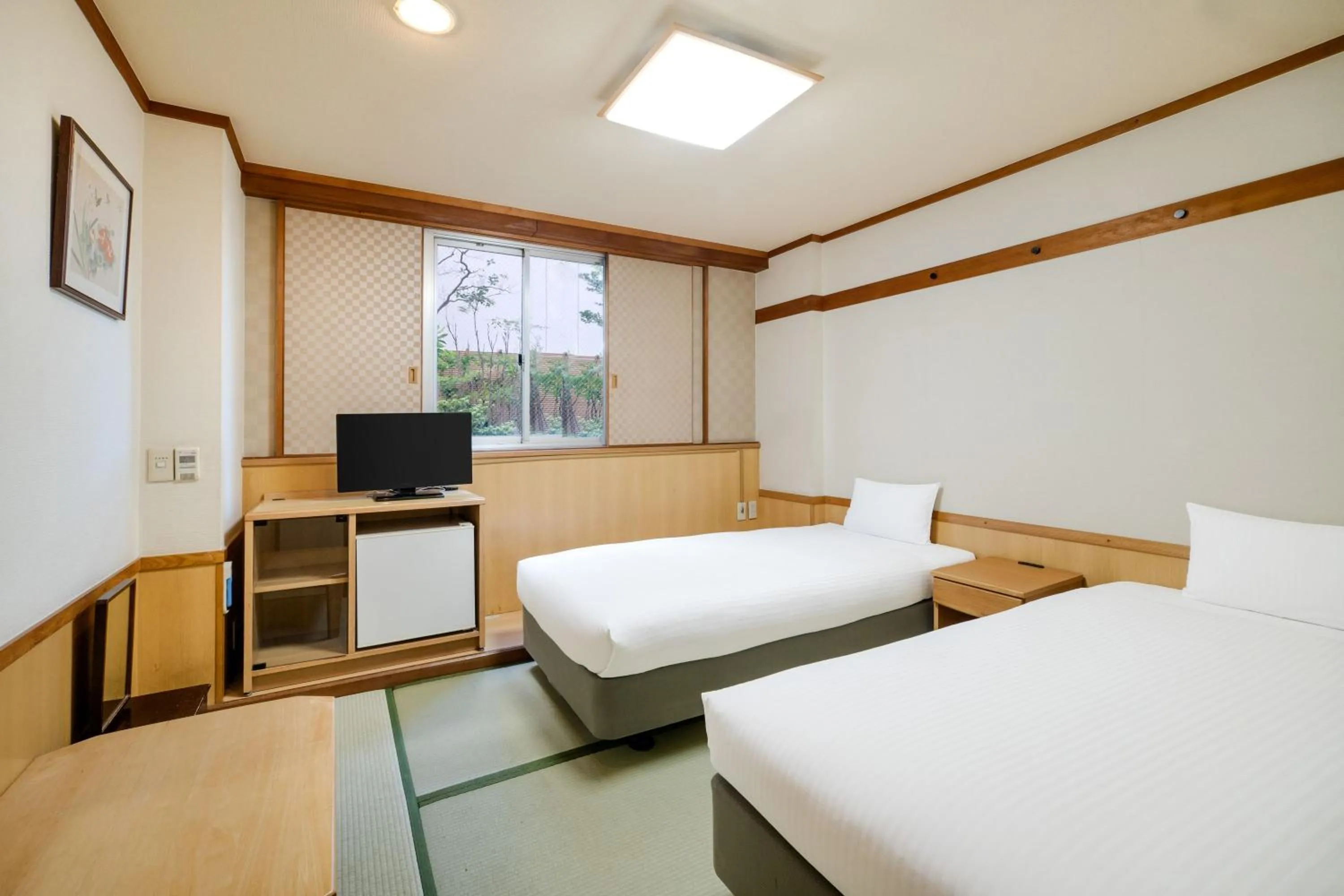 Bed in Central Hotel Sasebo