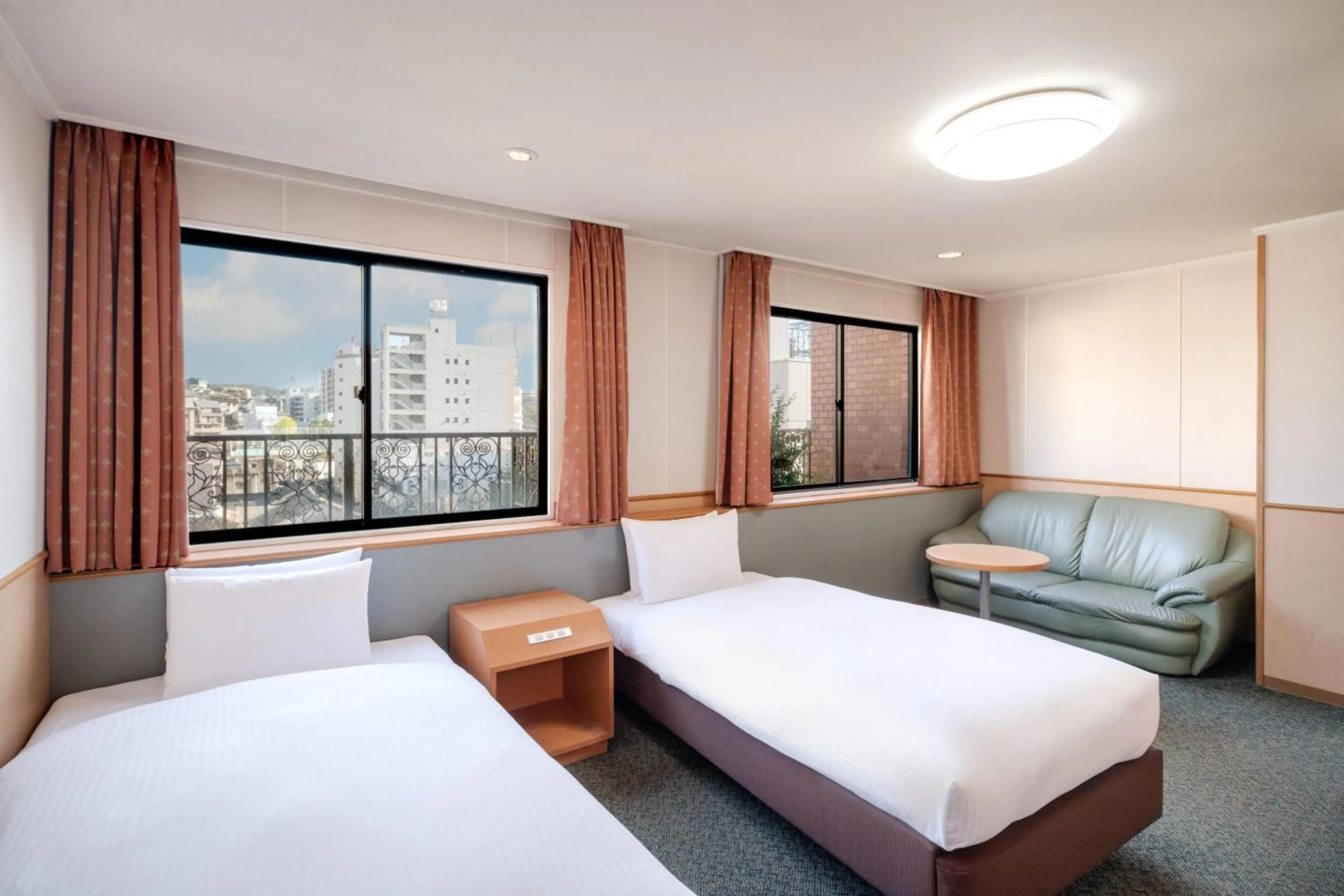 Bed in Central Hotel Sasebo