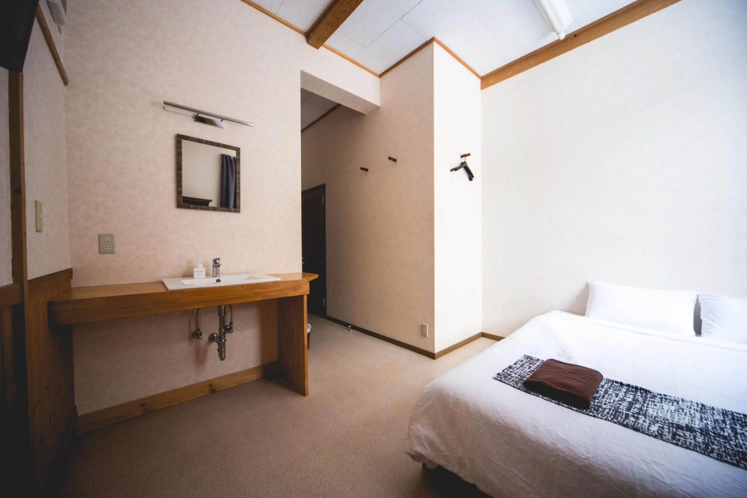 Bed in Hakuba Cortina Lodge