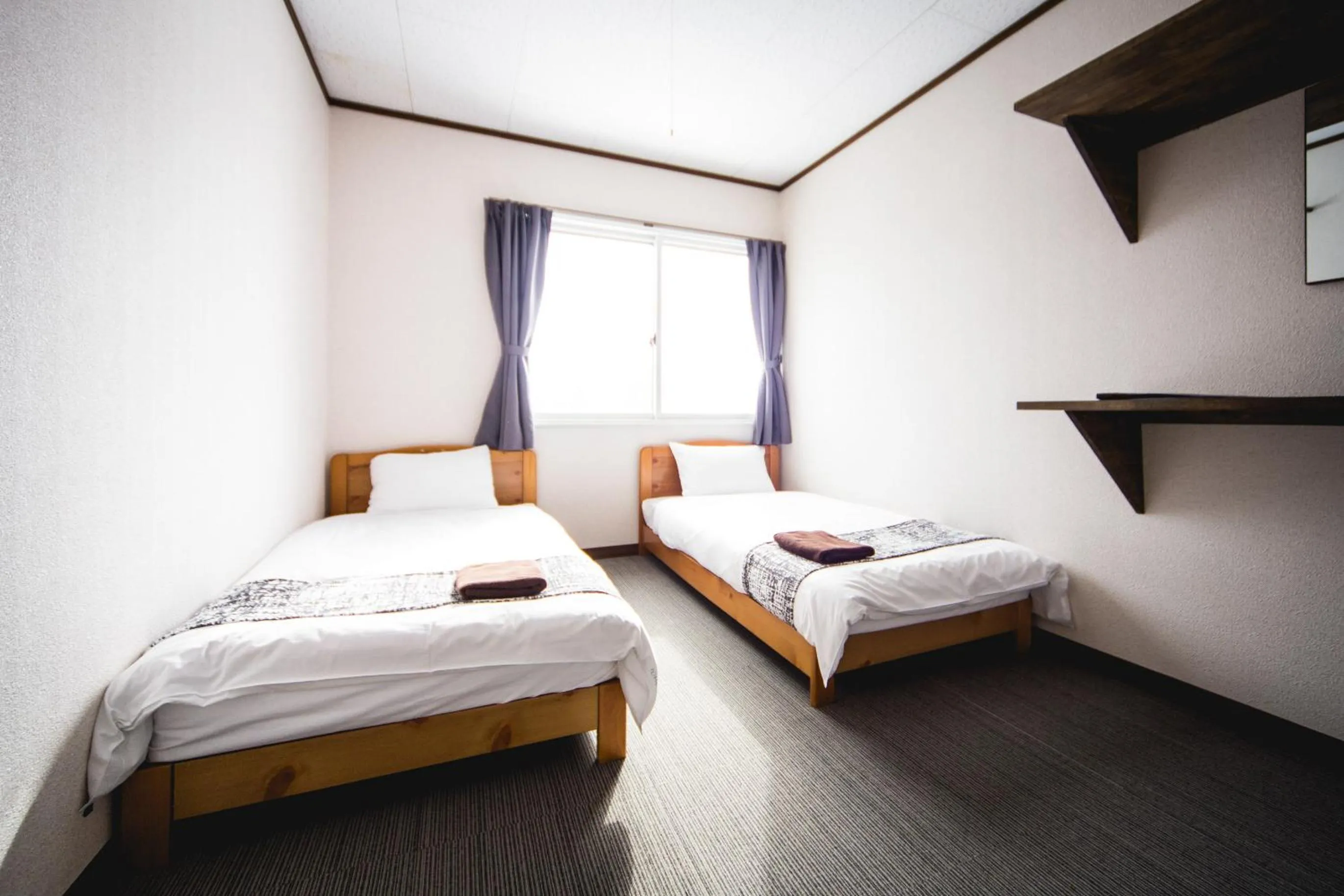 Bed in Hakuba Cortina Lodge