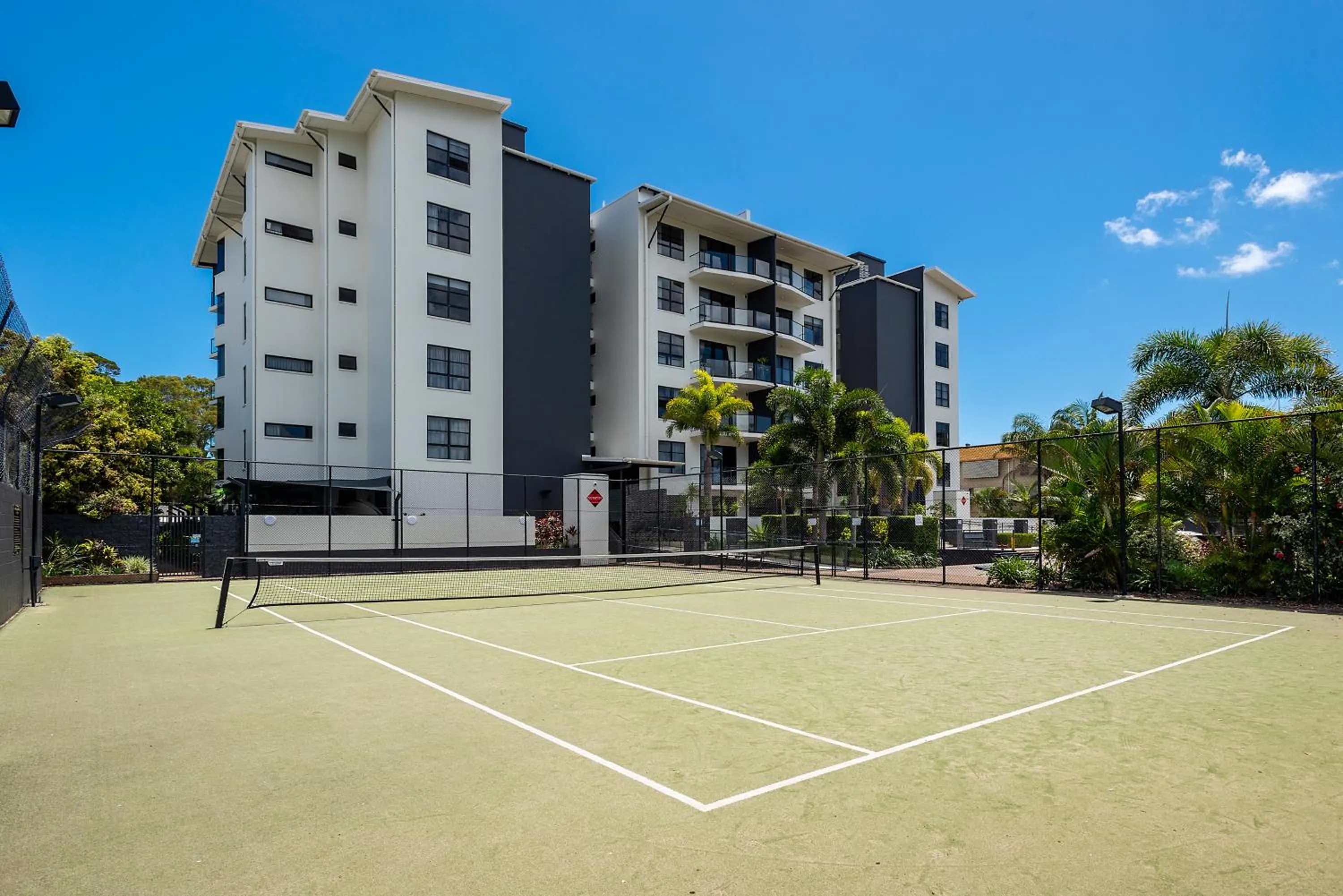 Tennis court in The Bay Apartments