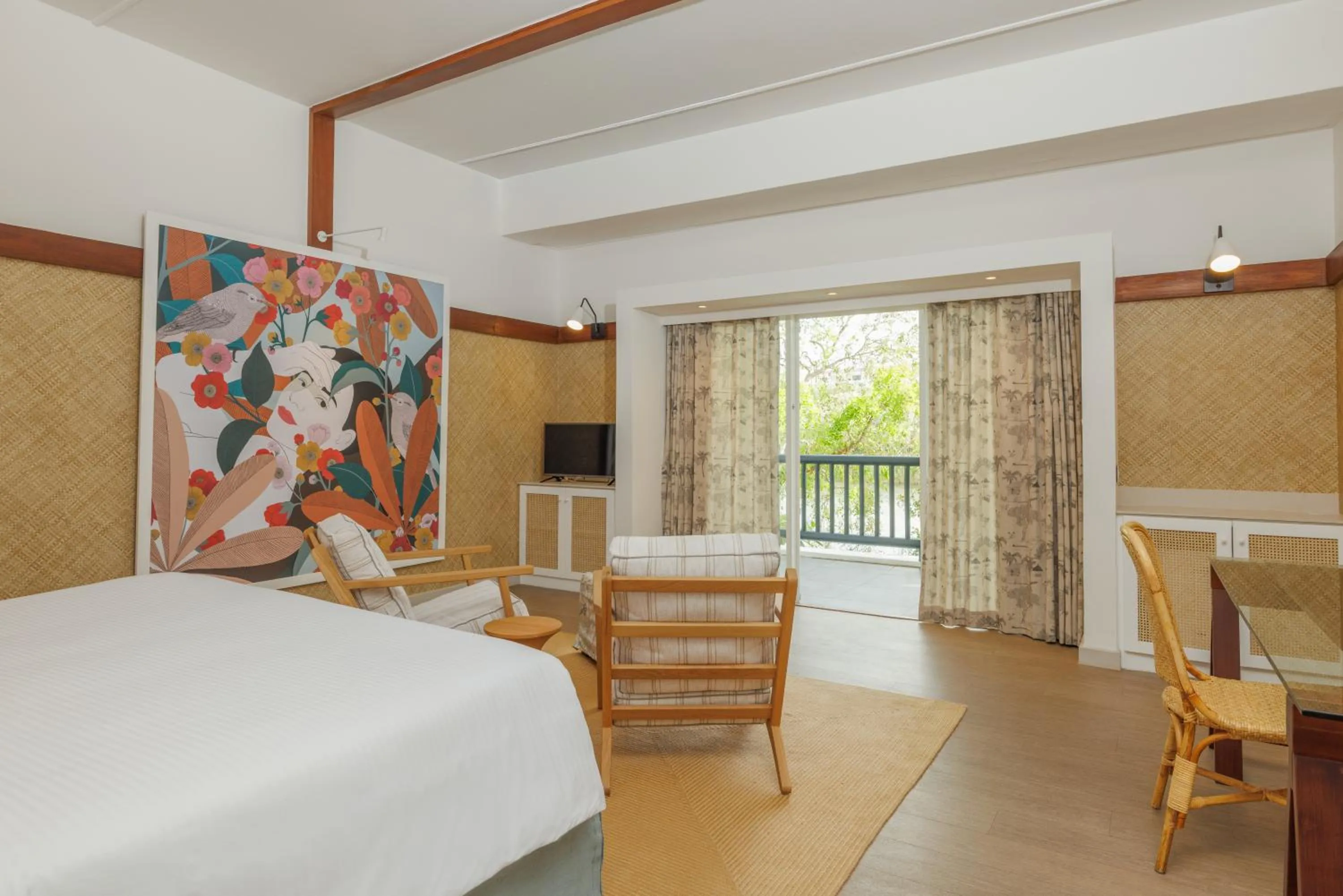 Seating area, Bed in The Ravenala Attitude