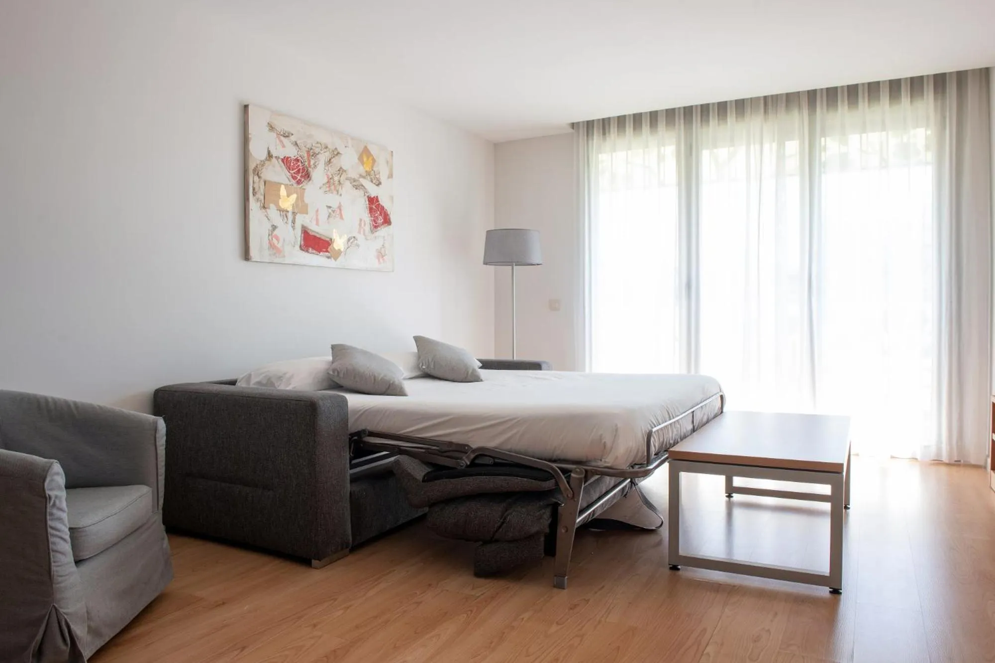 Living room, Bed in Apartamentos Aura Park Fira BCN