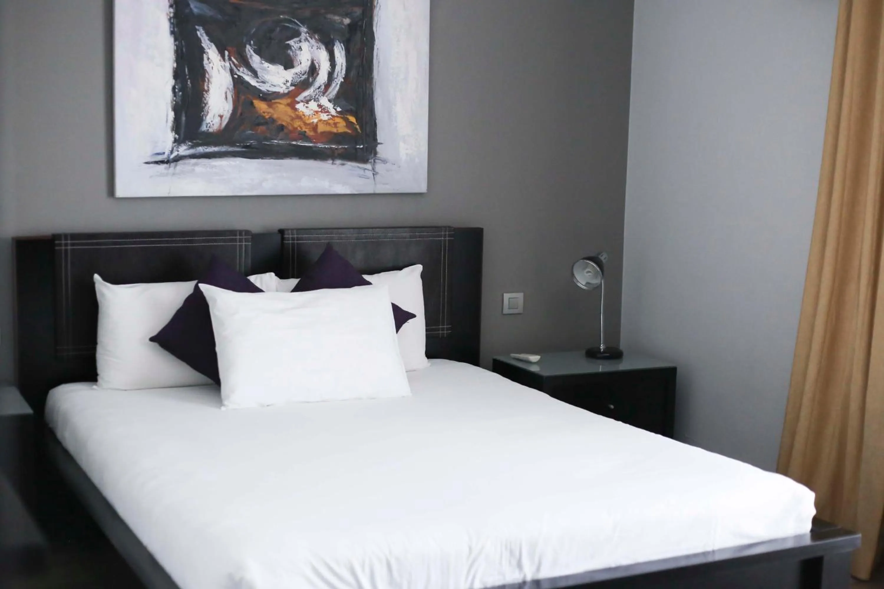 Bed in Pebbles Boutique Aparthotel