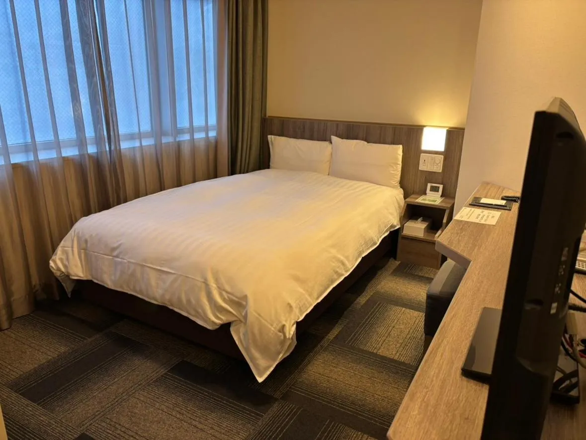 Bed in Dormy Inn Korakuen