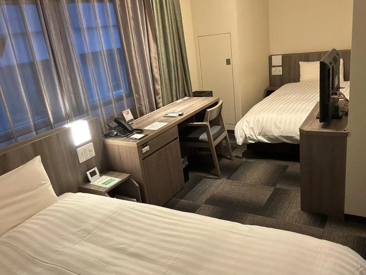 Bed in Dormy Inn Korakuen
