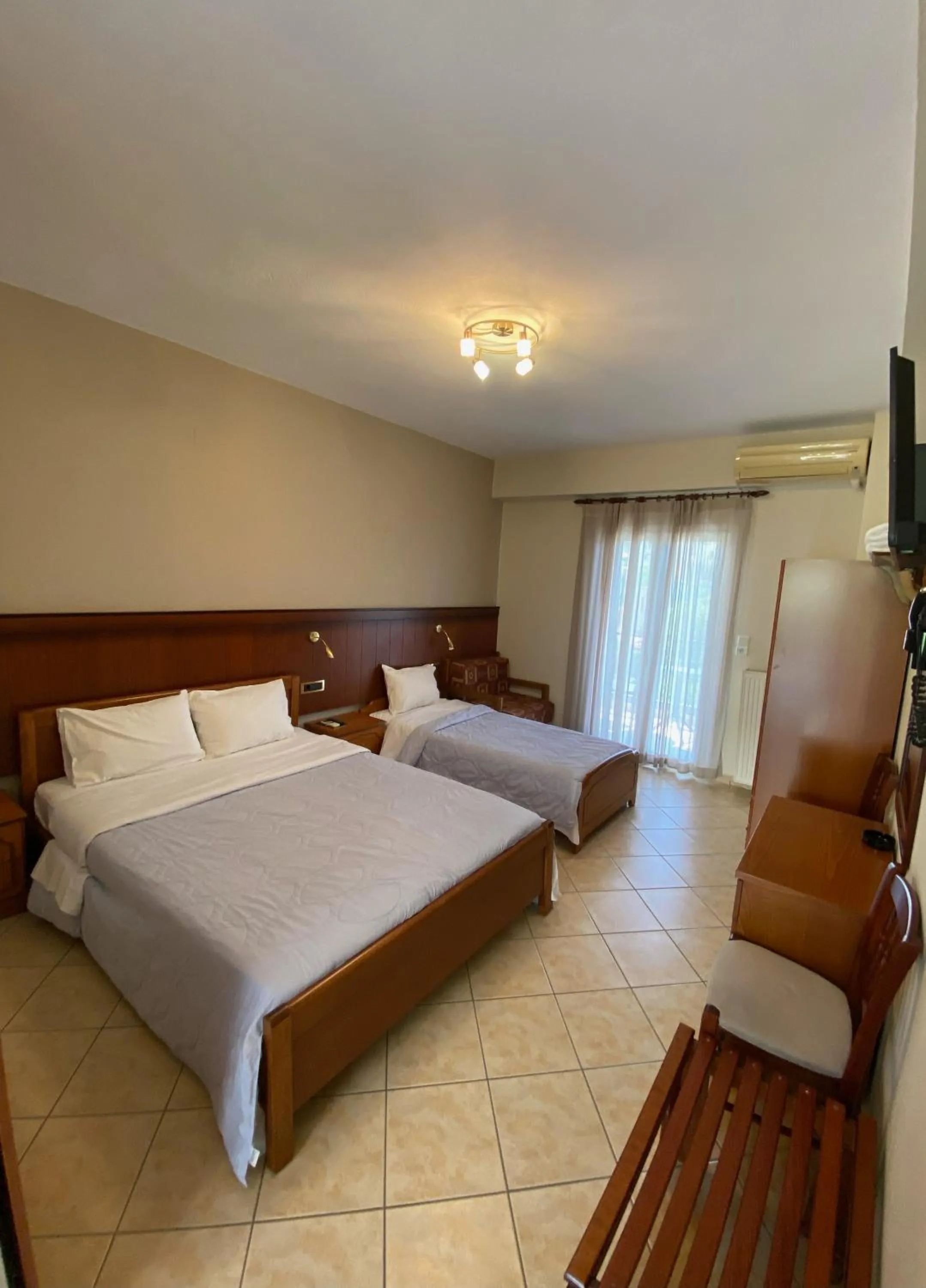 Bed in Paradosi Rooms