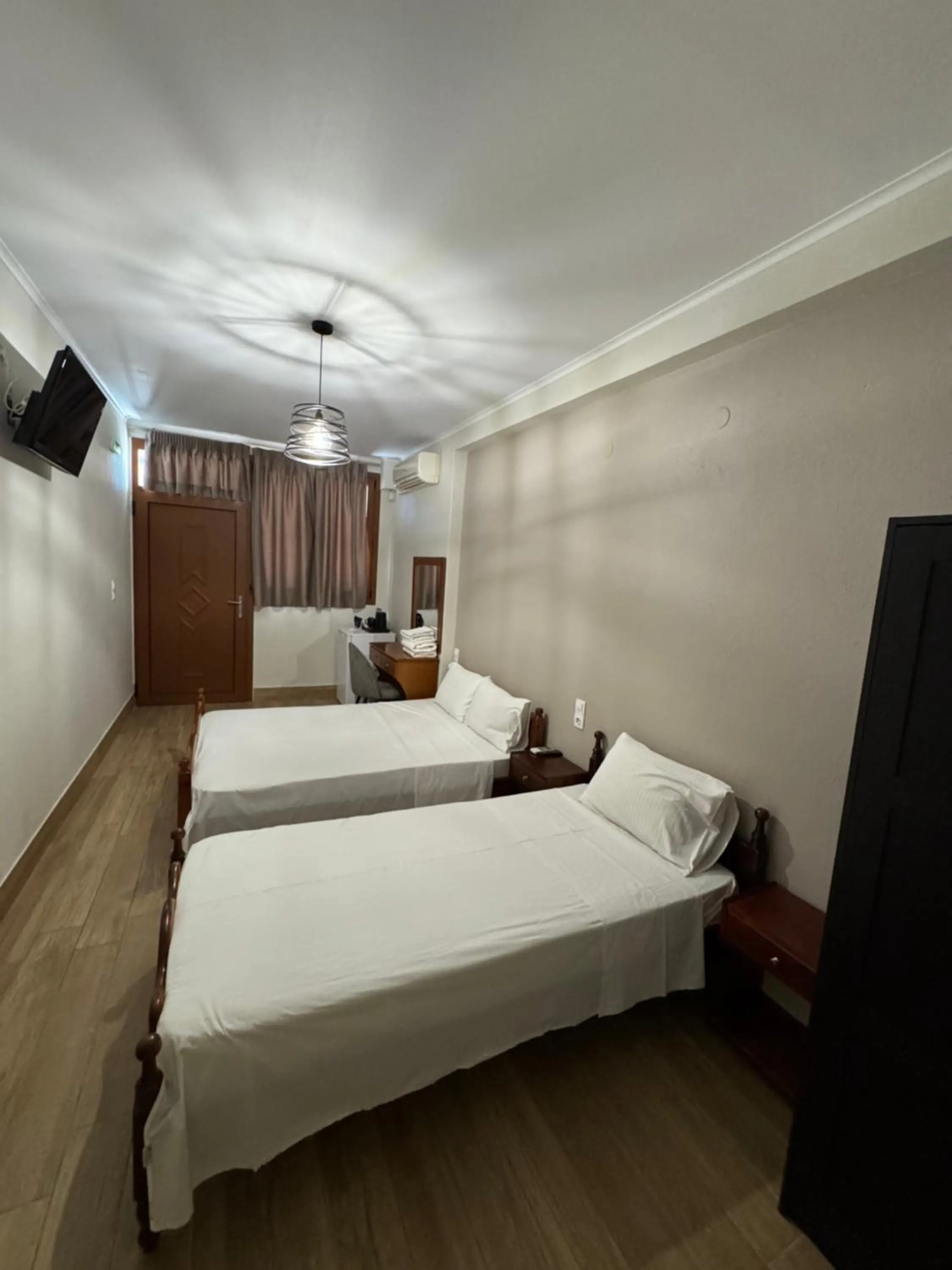 Bed in Paradosi Rooms