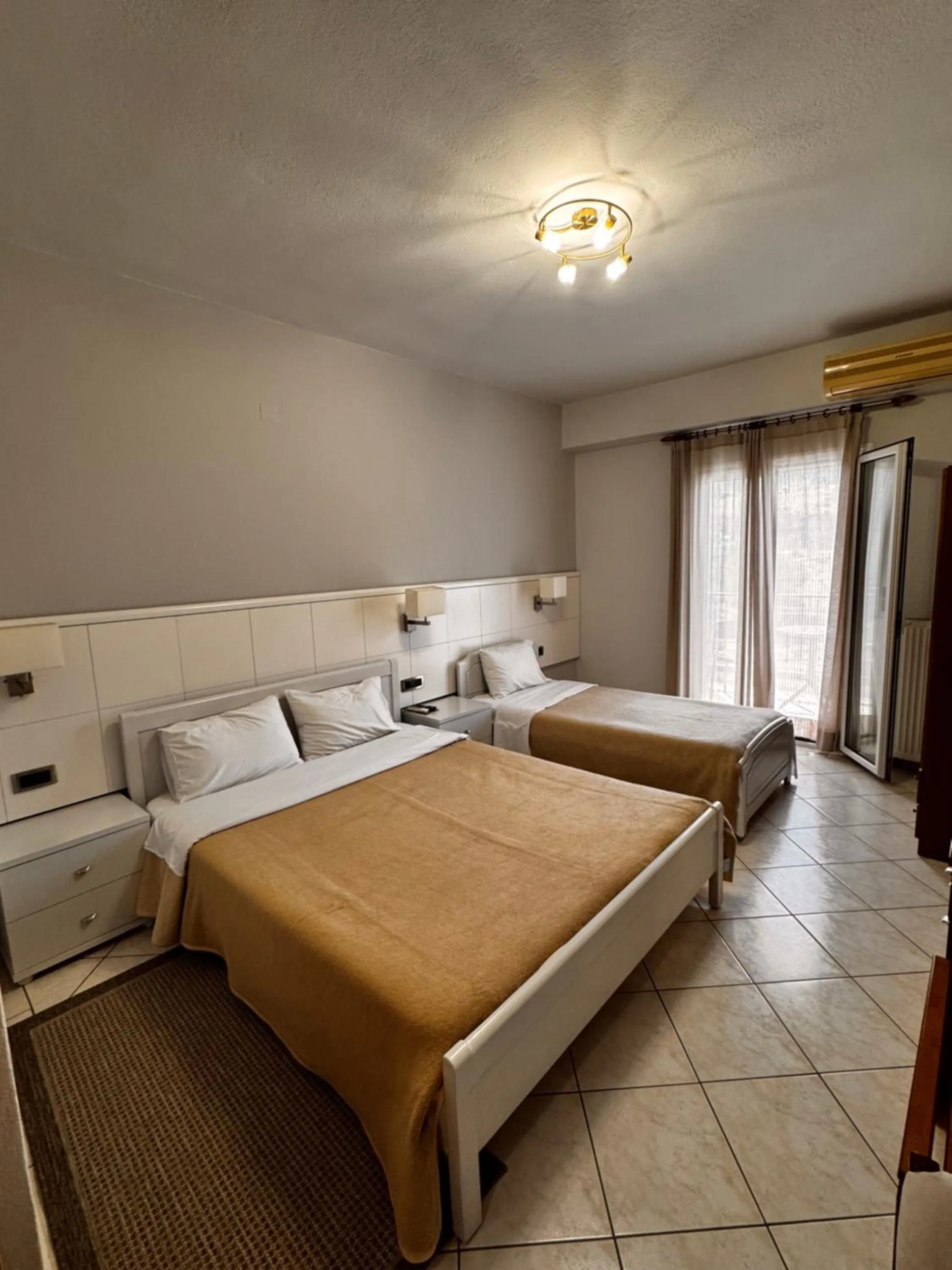 Bed in Paradosi Rooms