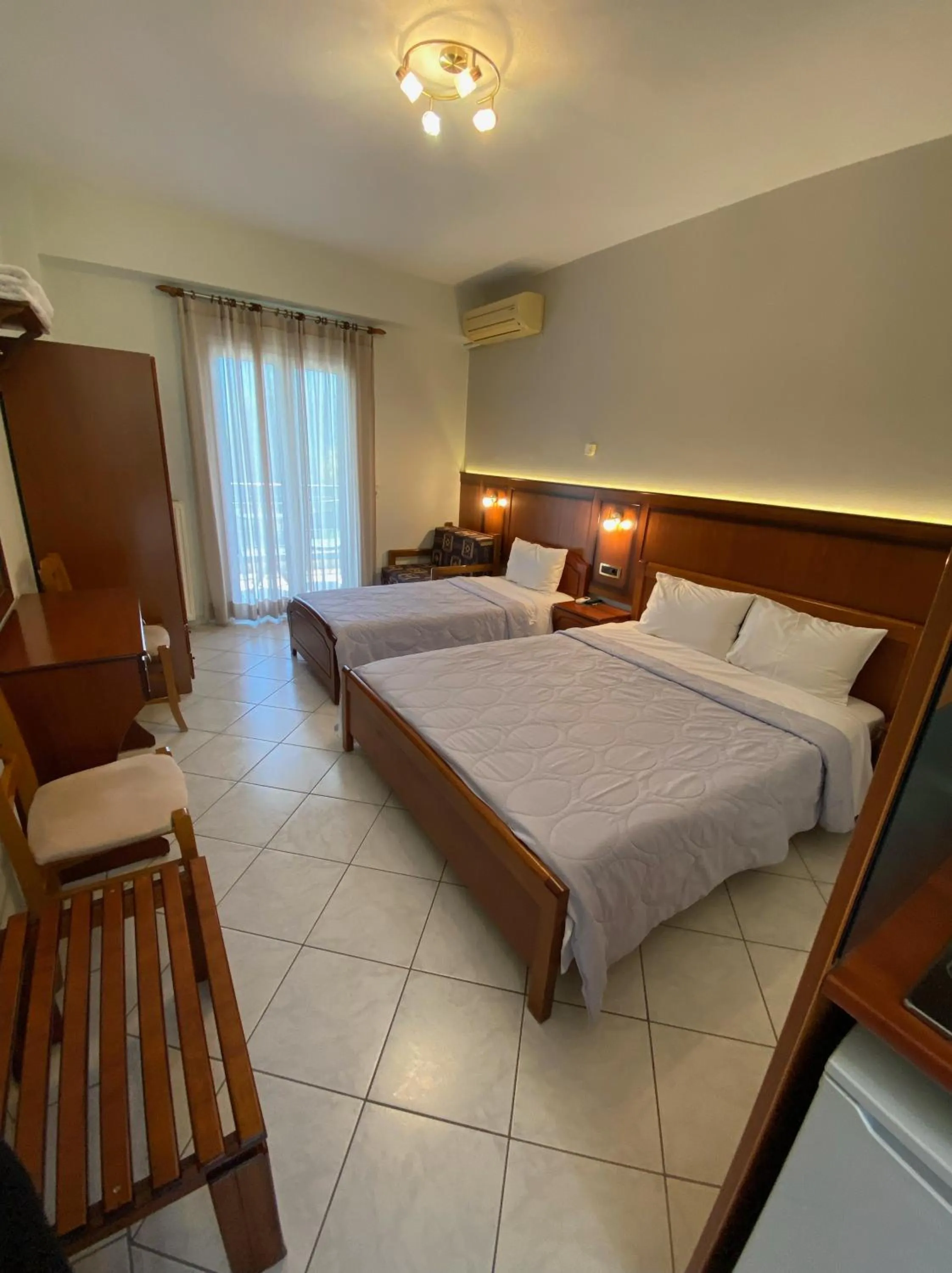 Bed in Paradosi Rooms