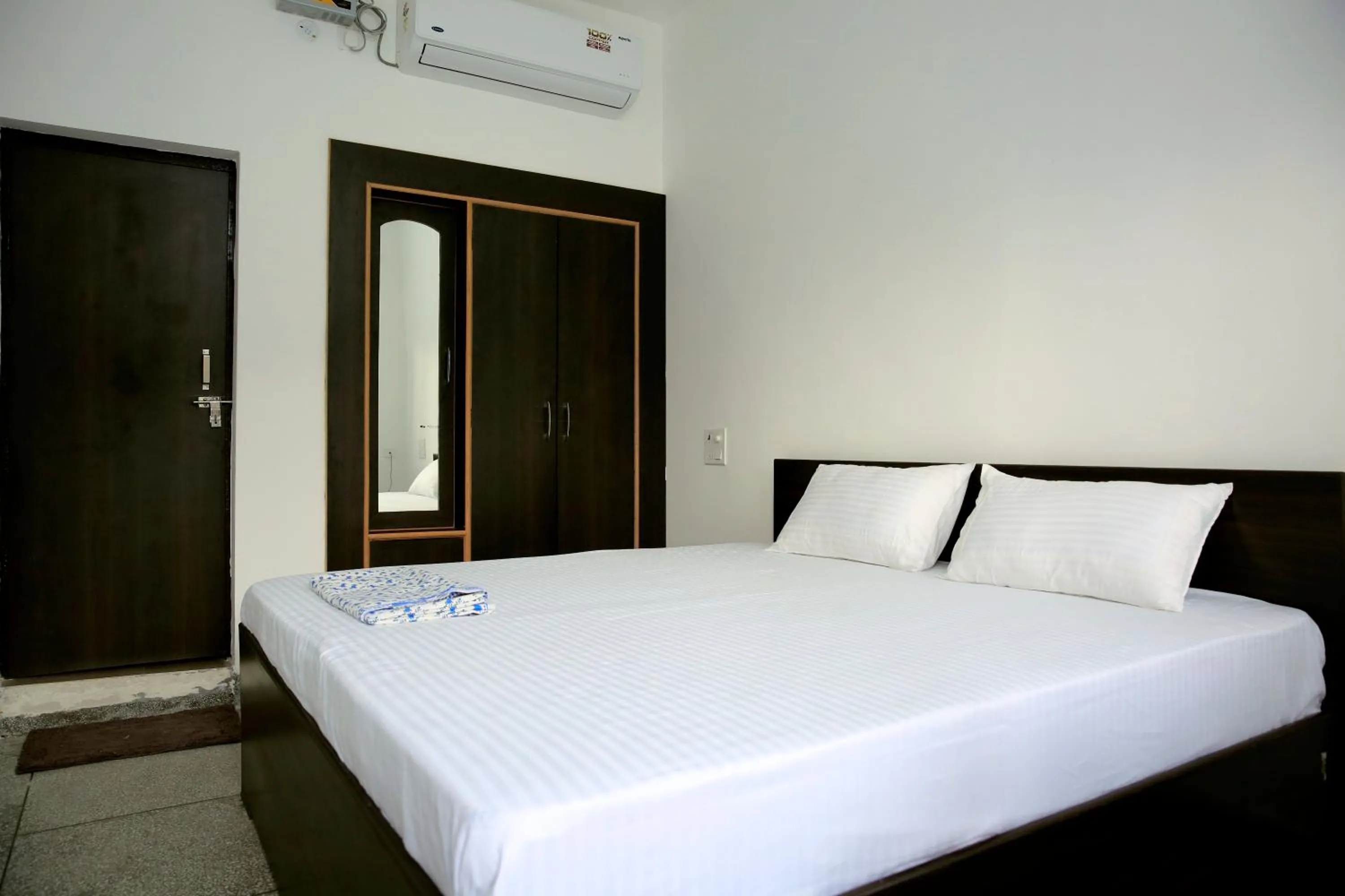Bed in Sanidhya Inn