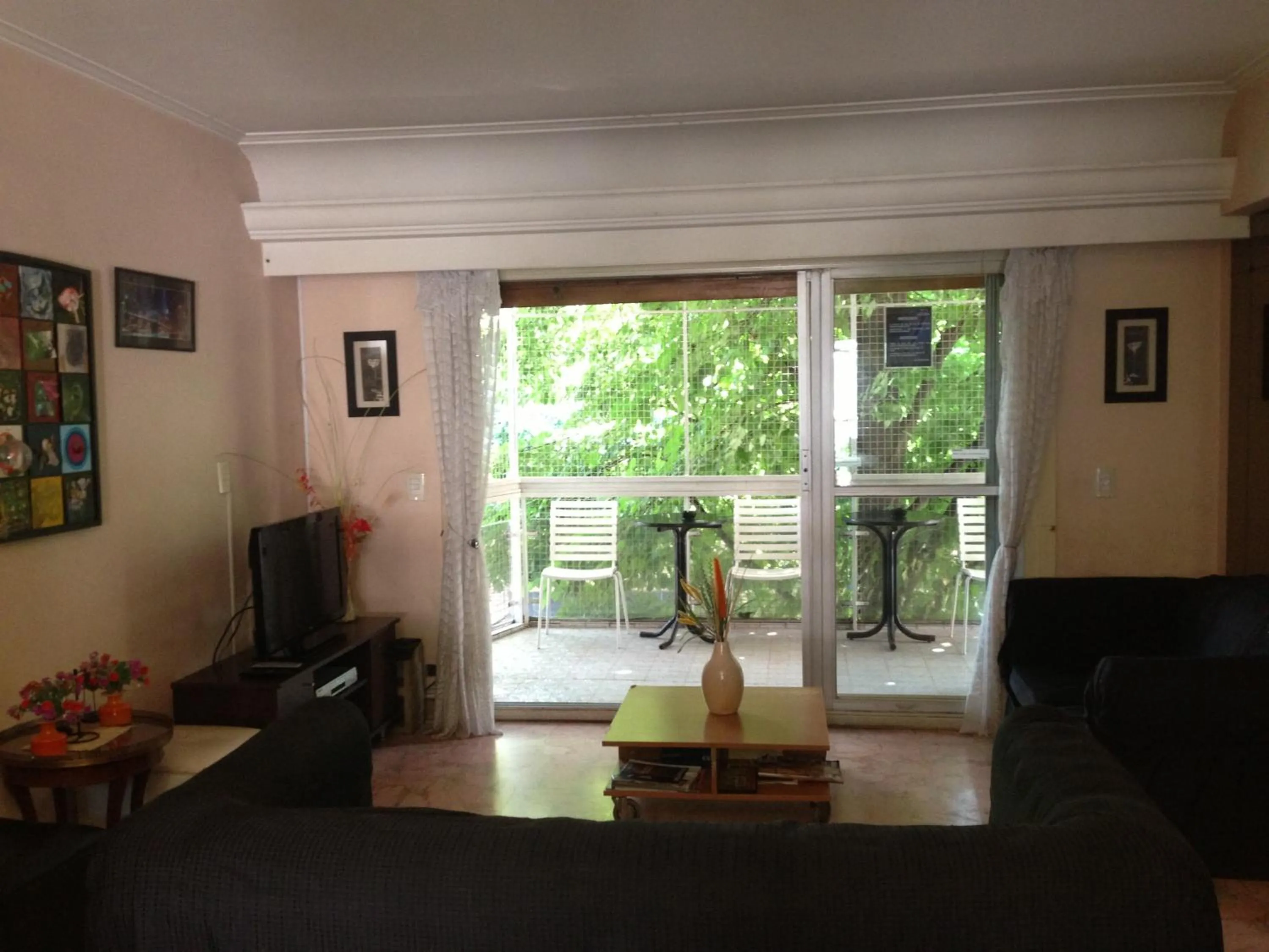 Communal lounge/ TV room in Palermo Soho Hostel