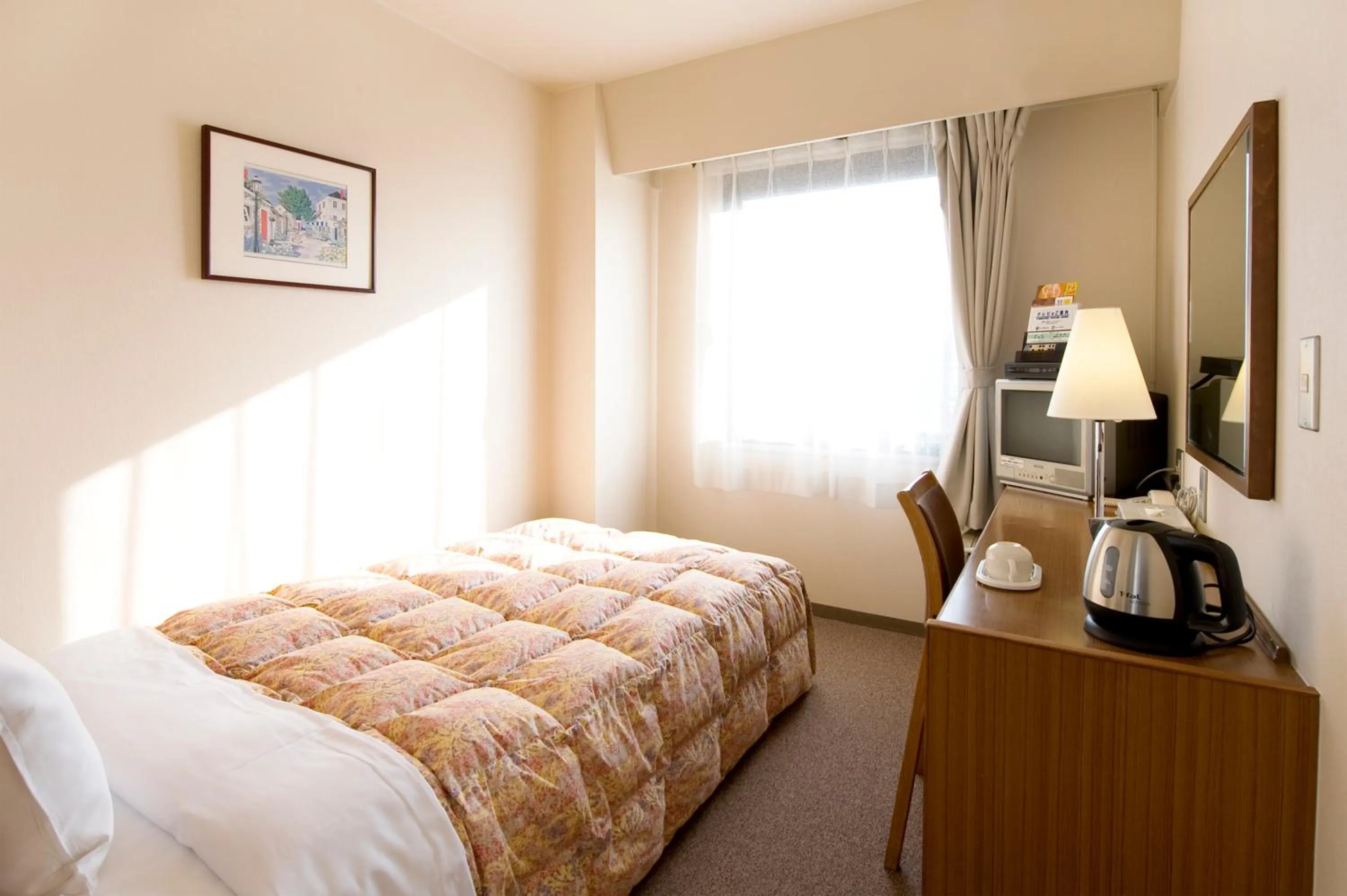 Bed in Hotel Keifuku Fukui Ekimae