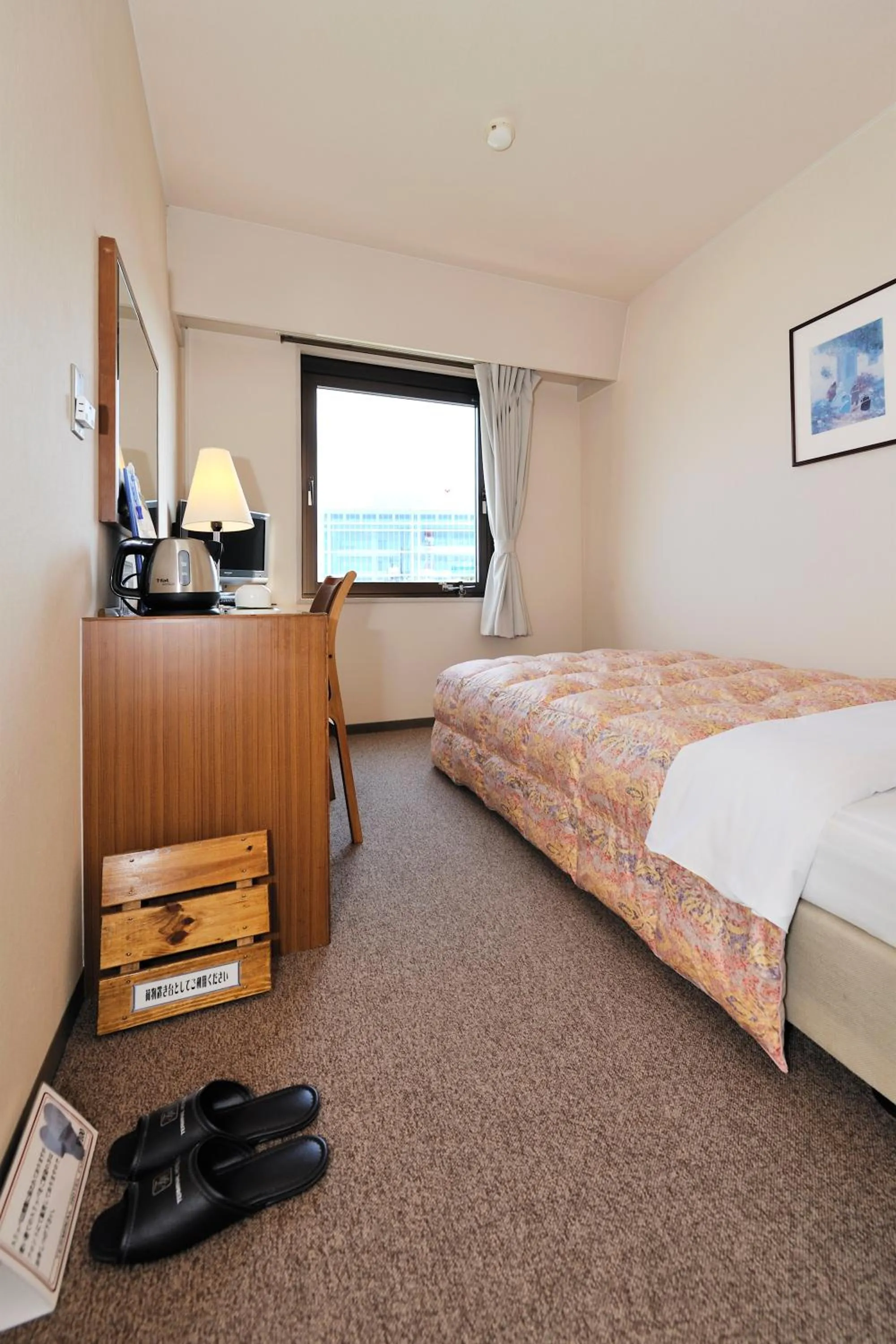 Bed in Hotel Keifuku Fukui Ekimae