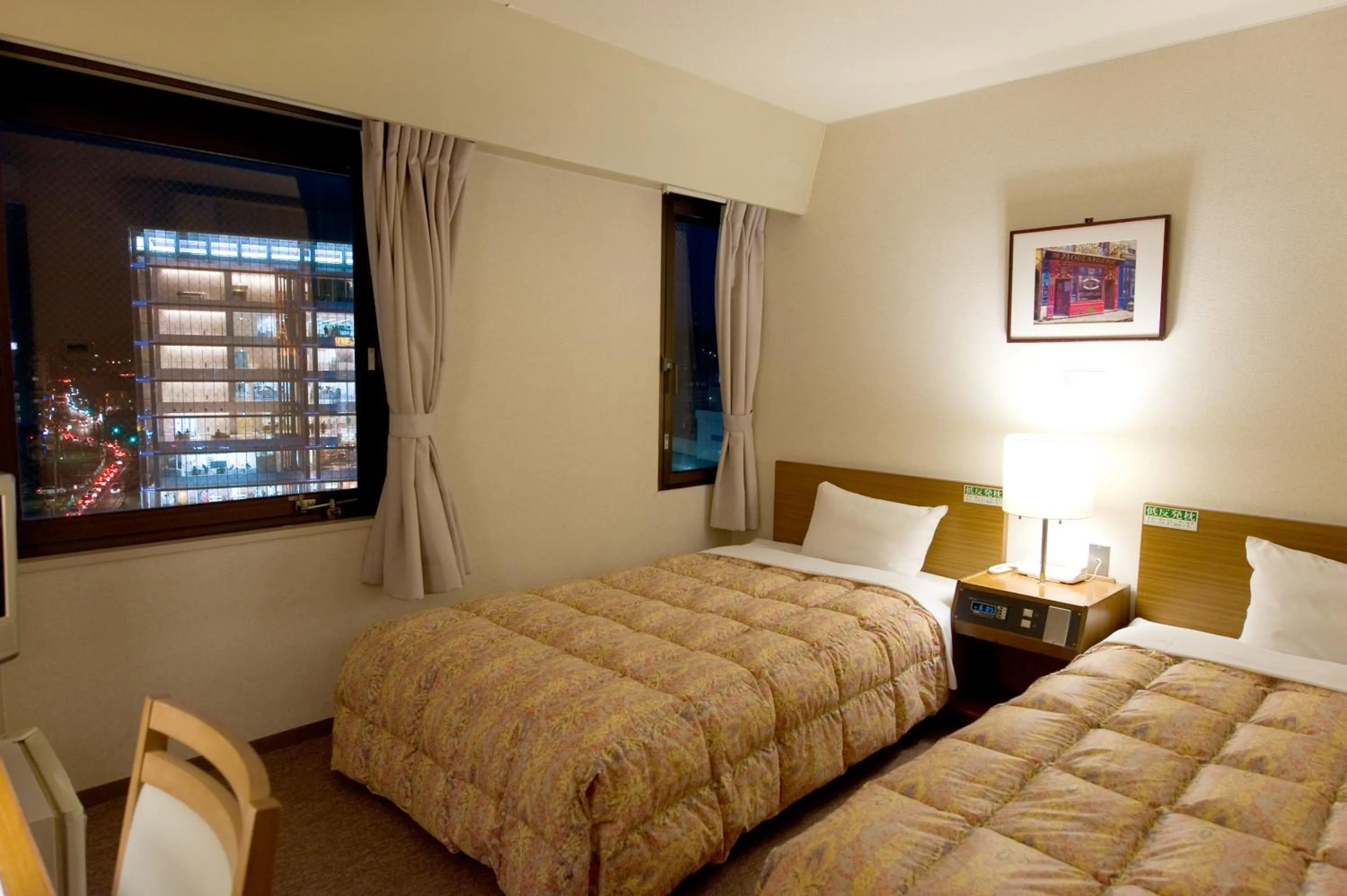 Bed in Hotel Keifuku Fukui Ekimae