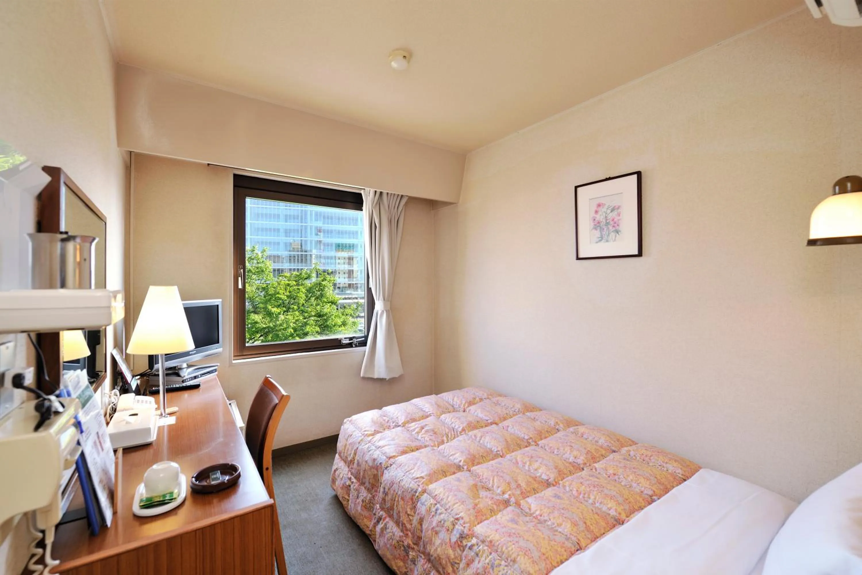 Bed in Hotel Keifuku Fukui Ekimae