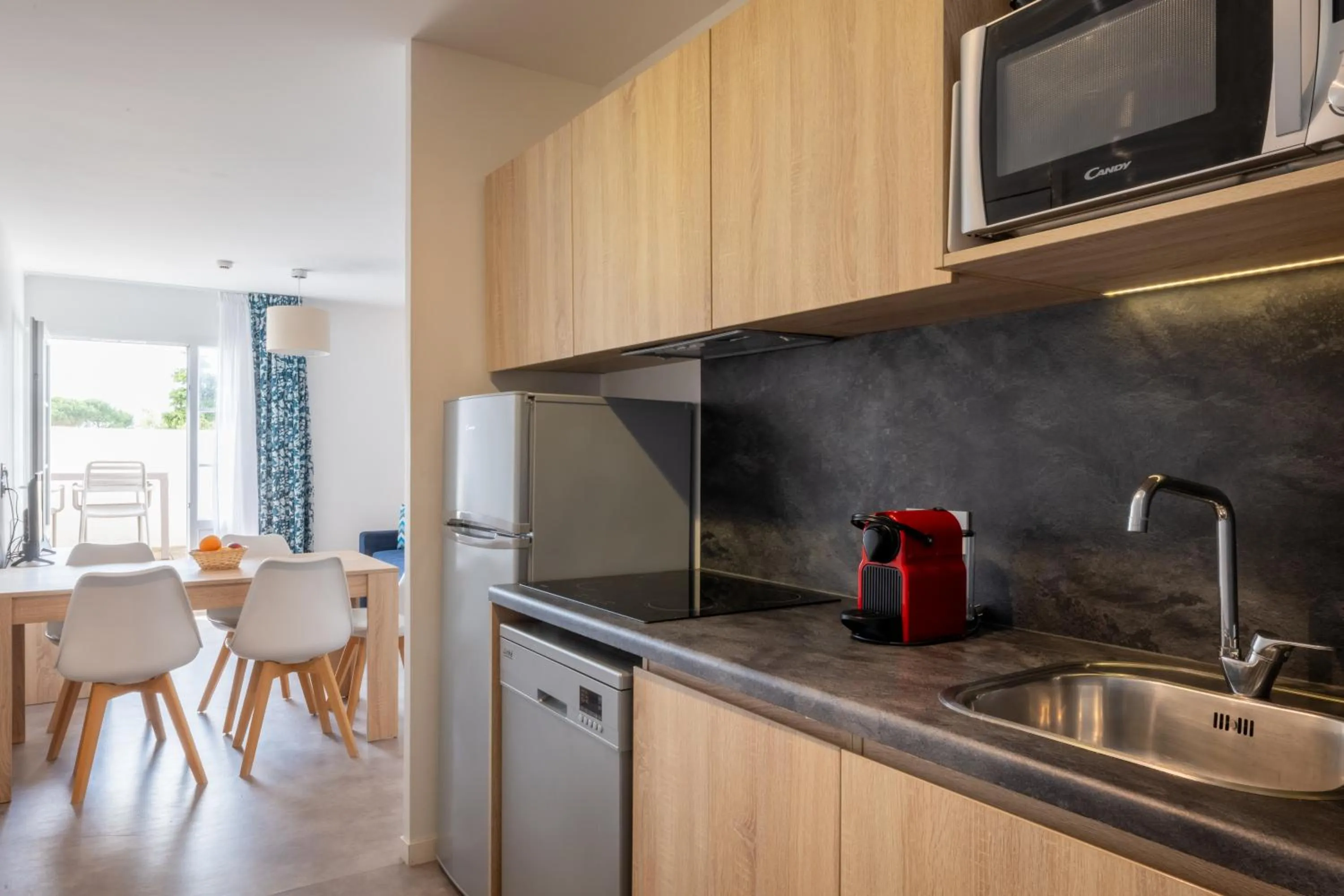 Kitchen or kitchenette in Résidence Odalys Rêve d'île