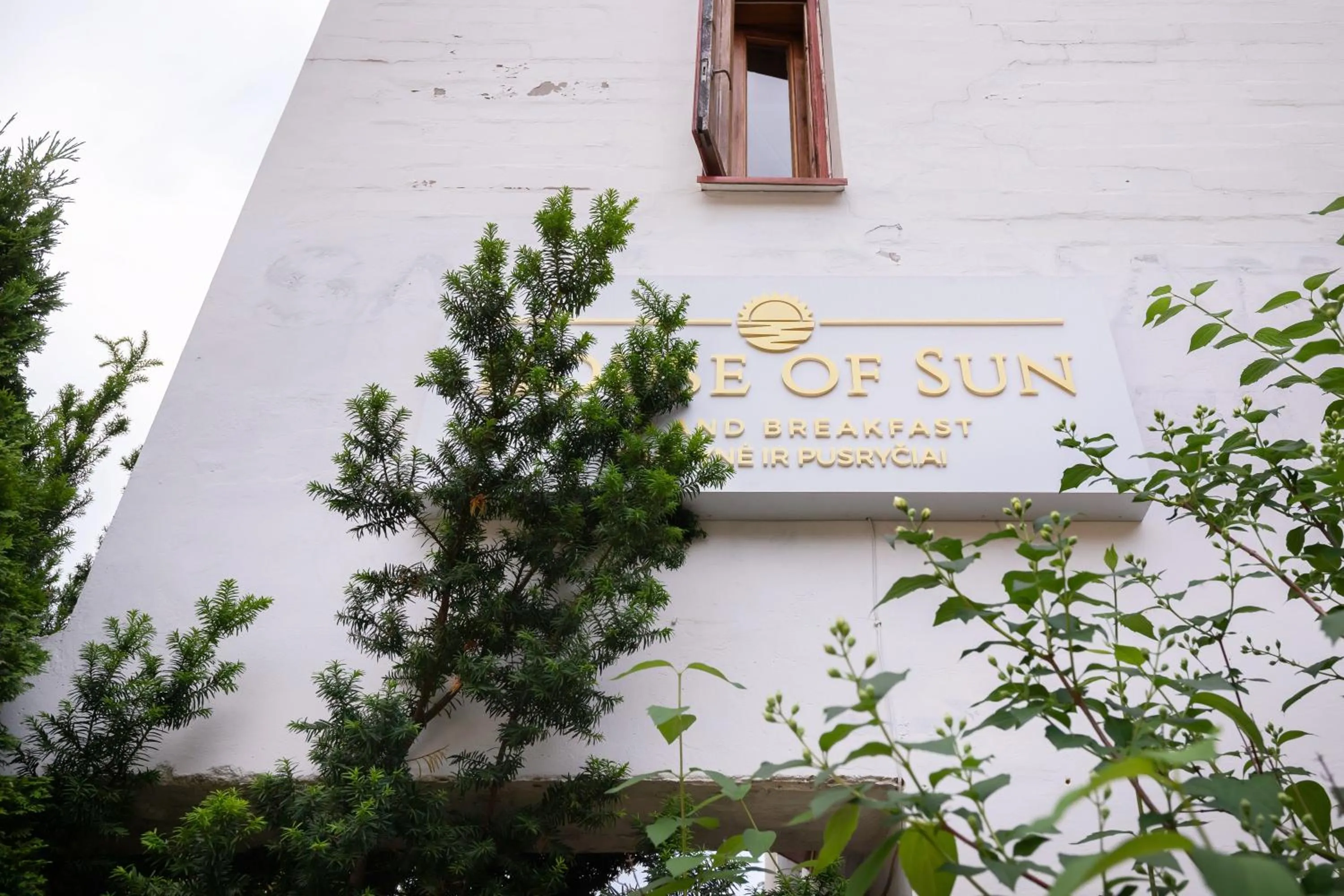 Property logo or sign in House of Sun