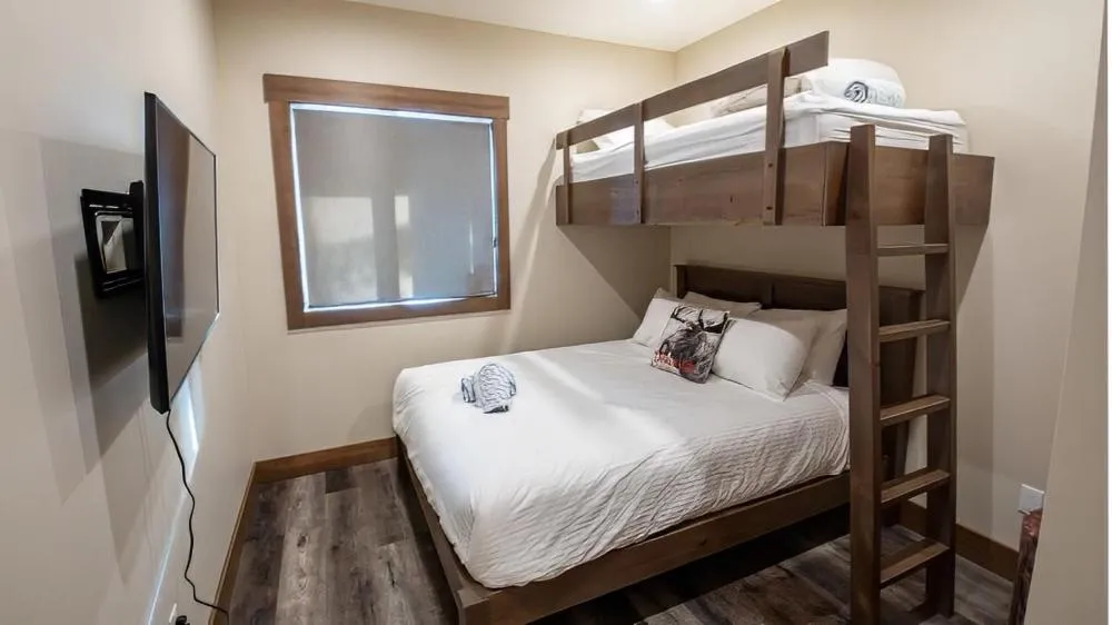 Bed in Snow Creek Cabins by Fernie Lodging Co