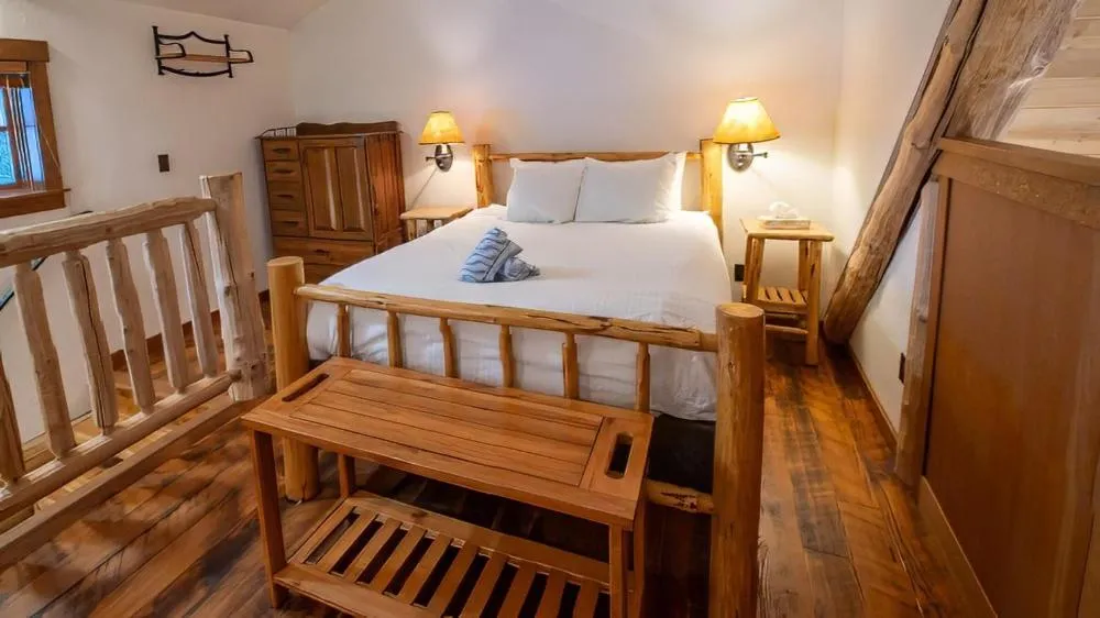 Bed in Snow Creek Cabins by Fernie Lodging Co