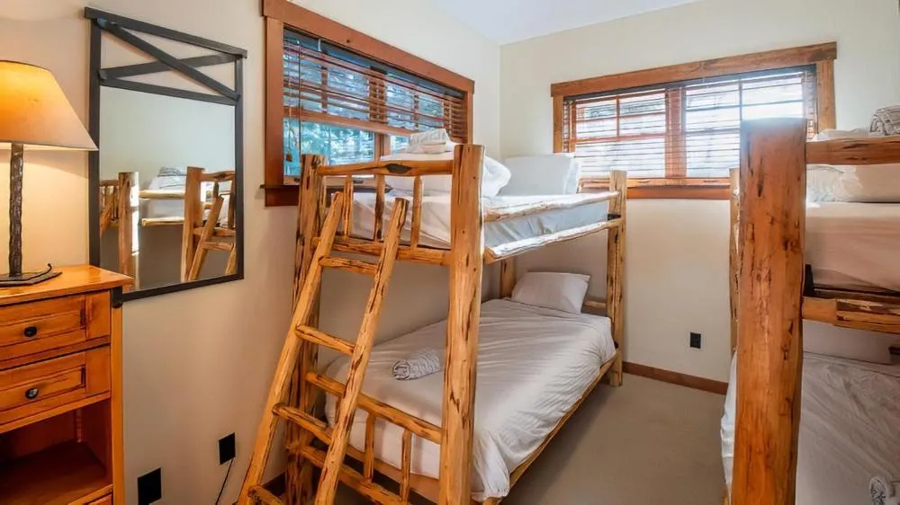 Bed in Snow Creek Cabins by Fernie Lodging Co