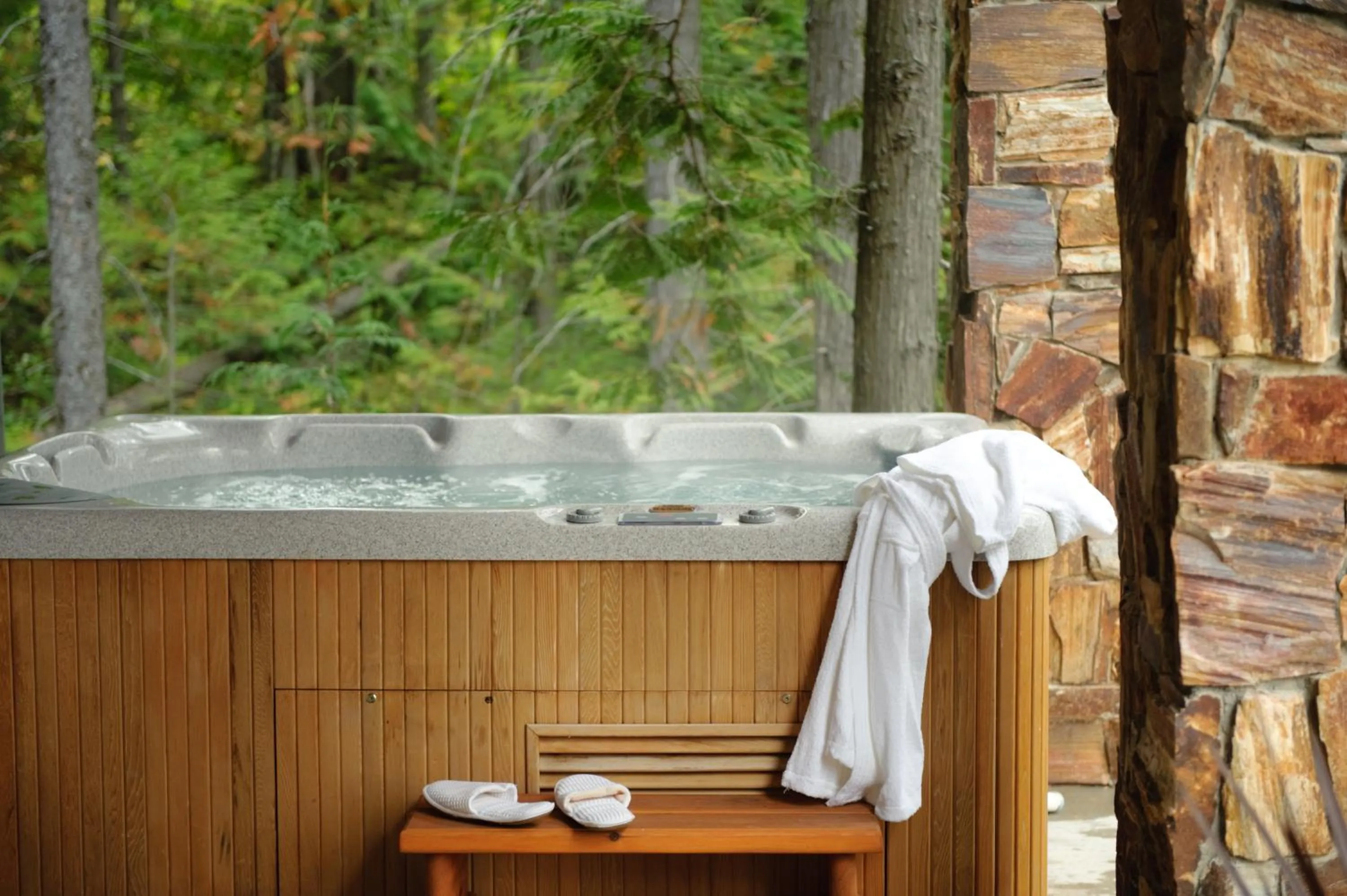 Hot Spring Bath in Snow Creek Cabins by Fernie Lodging Co