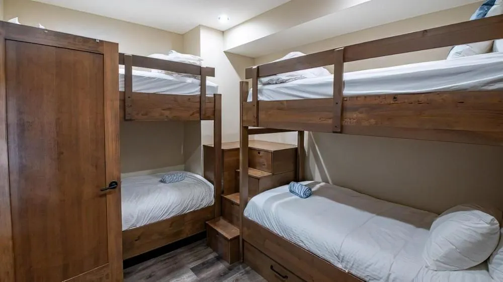 Bed in Snow Creek Cabins by Fernie Lodging Co