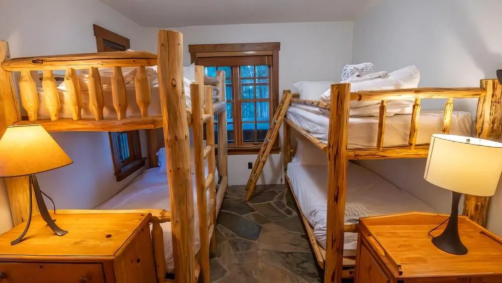 Bed in Snow Creek Cabins by Fernie Lodging Co