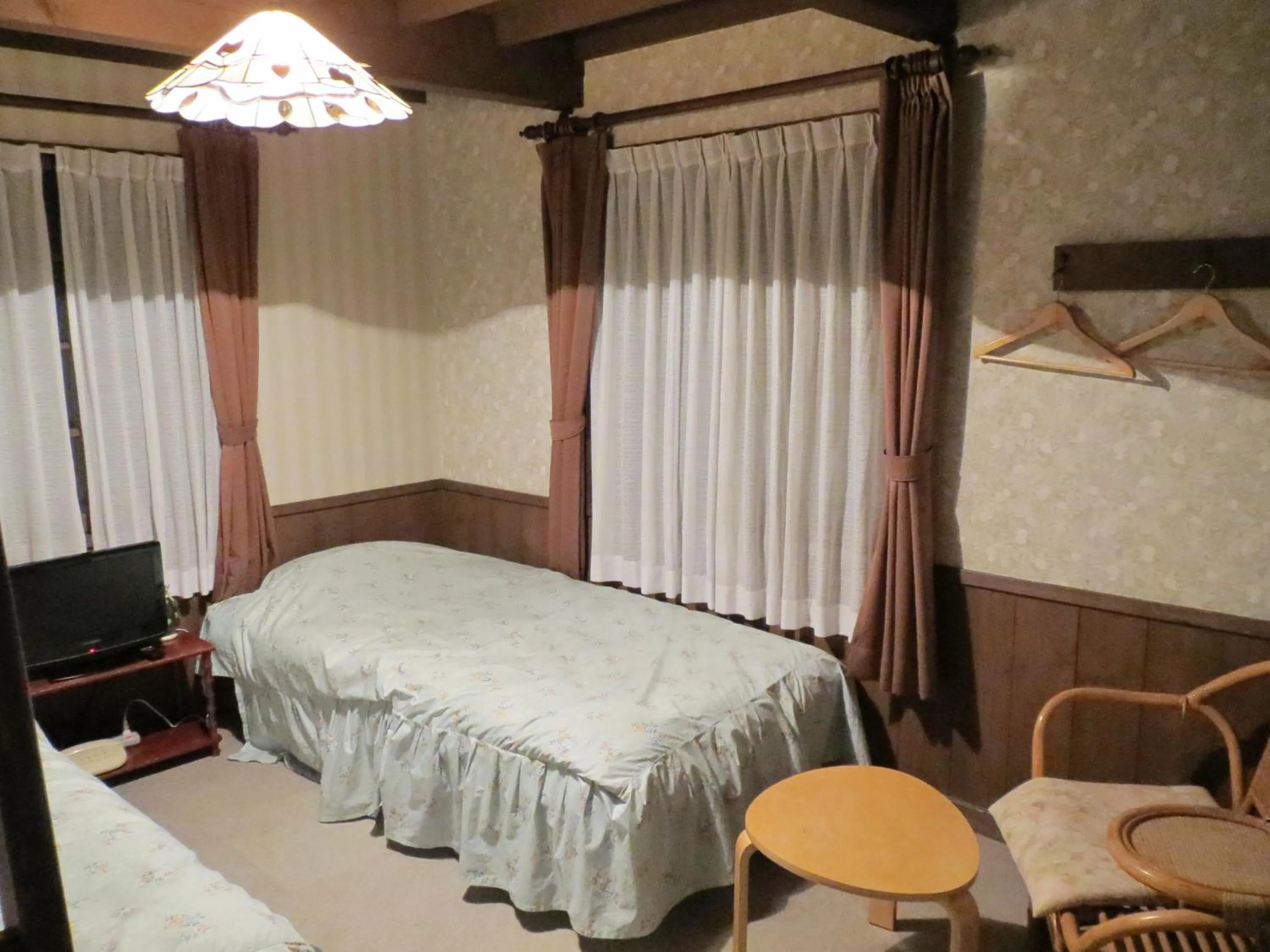 Photo of the whole room, Bed in Pension Marionette