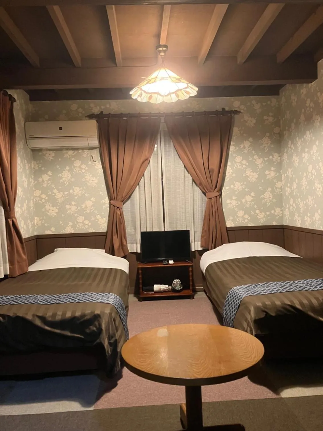 Photo of the whole room, Bed in Pension Marionette